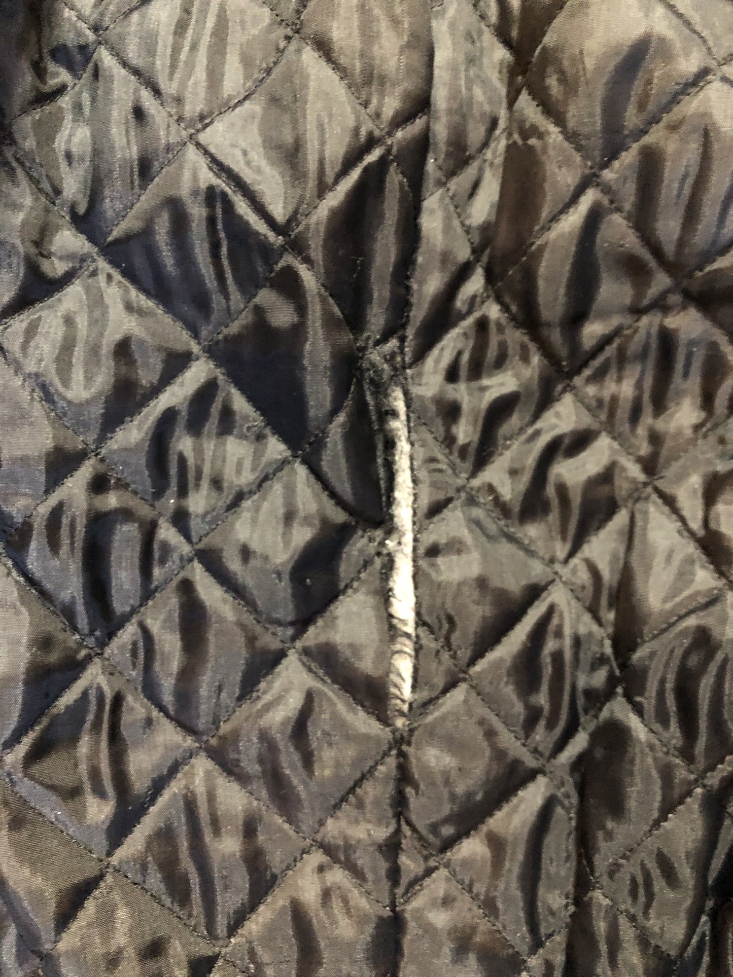 Kingspier Vintage - Action black leather motorcycle jacket with fringe detail and belt at waist. Zipper closure and zip slash pockets, quilted lining with inside pocket. Made in Canada. Size 40.