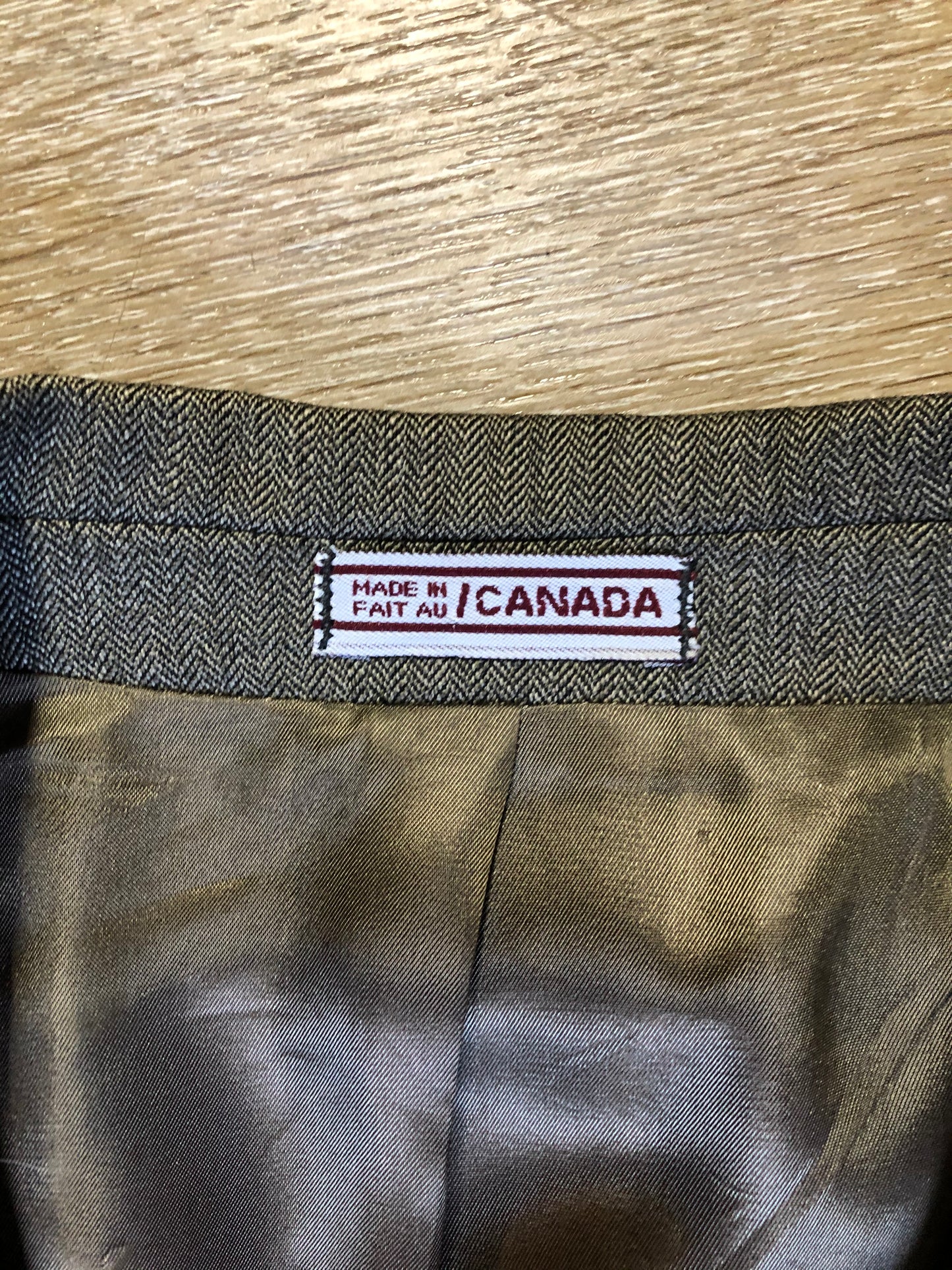 Kingspier Vintage - WM.H. Leishman ( at Tip Top Tailors) two piece medium grey 100% pure virgin wool suit.The jacket is a single breasted, two button notch lapel with two flap pockets and two inside pockets. Pants are pleated with welt pockets. Made in Canada.