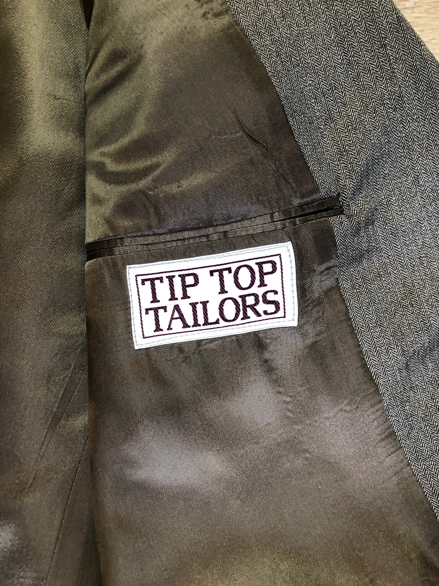 Kingspier Vintage - WM.H. Leishman ( at Tip Top Tailors) two piece medium grey 100% pure virgin wool suit.The jacket is a single breasted, two button notch lapel with two flap pockets and two inside pockets. Pants are pleated with welt pockets. Made in Canada.