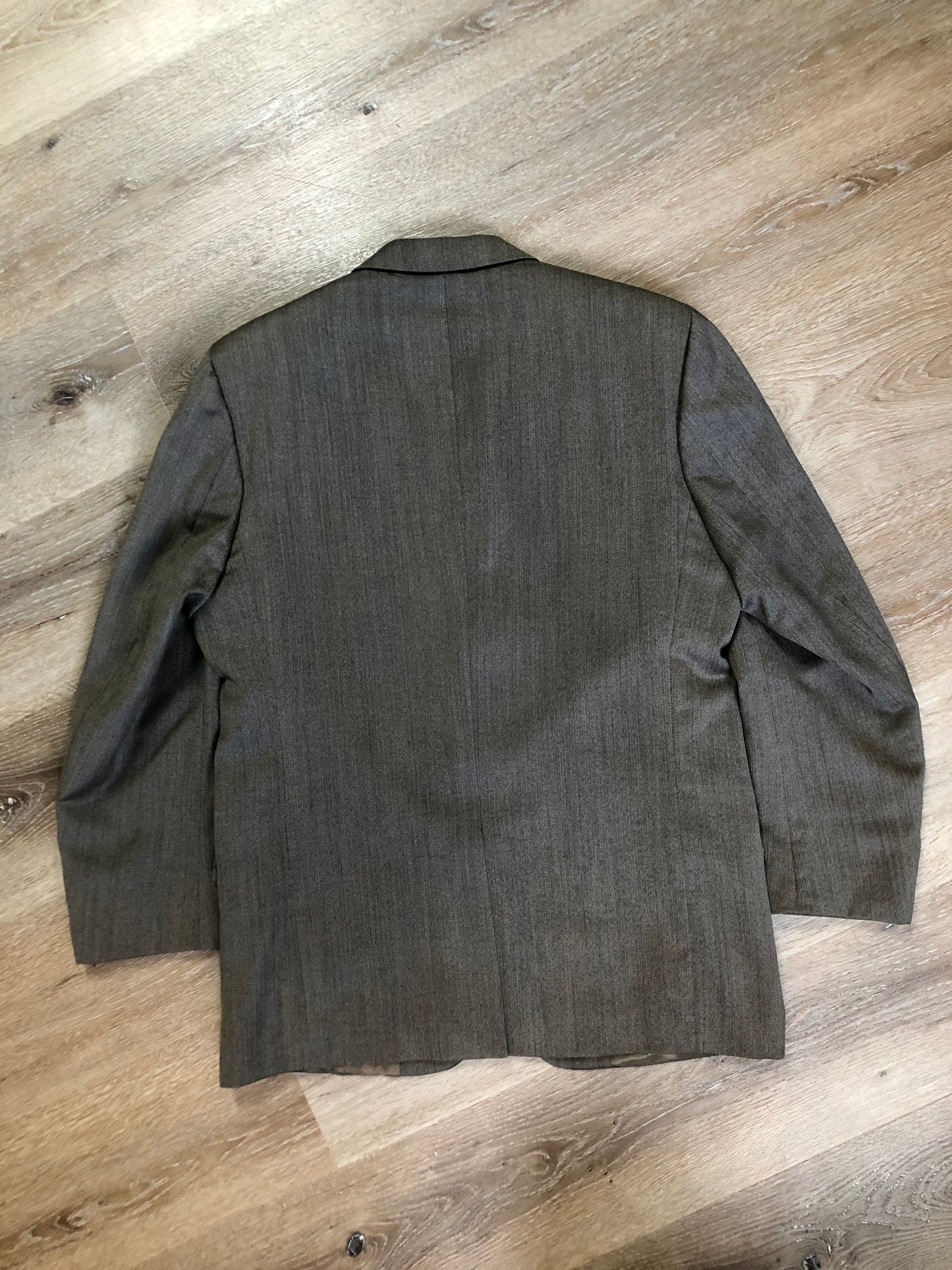 Kingspier Vintage - WM.H. Leishman ( at Tip Top Tailors) two piece medium grey 100% pure virgin wool suit.The jacket is a single breasted, two button notch lapel with two flap pockets and two inside pockets. Pants are pleated with welt pockets. Made in Canada.