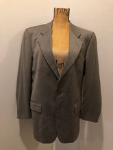 Load image into Gallery viewer, Kingspier Vintage - WM.H. Leishman ( at Tip Top Tailors) two piece medium grey 100% pure virgin wool suit.The jacket is a single breasted, two button notch lapel with two flap pockets and two inside pockets. Pants are pleated with welt pockets. Made in Canada. 
