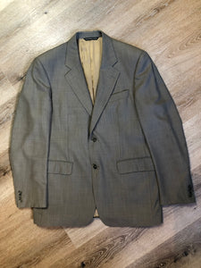 Kingspier Vintage - WM.H. Leishman (sold at Tip Top Tailors) two piece medium grey 100% pure virgin wool suit.The jacket is a single breasted, two button notch lapel with two flap pockets and two inside pockets. Pants are pleated with welt pockets. Made in Canada. 