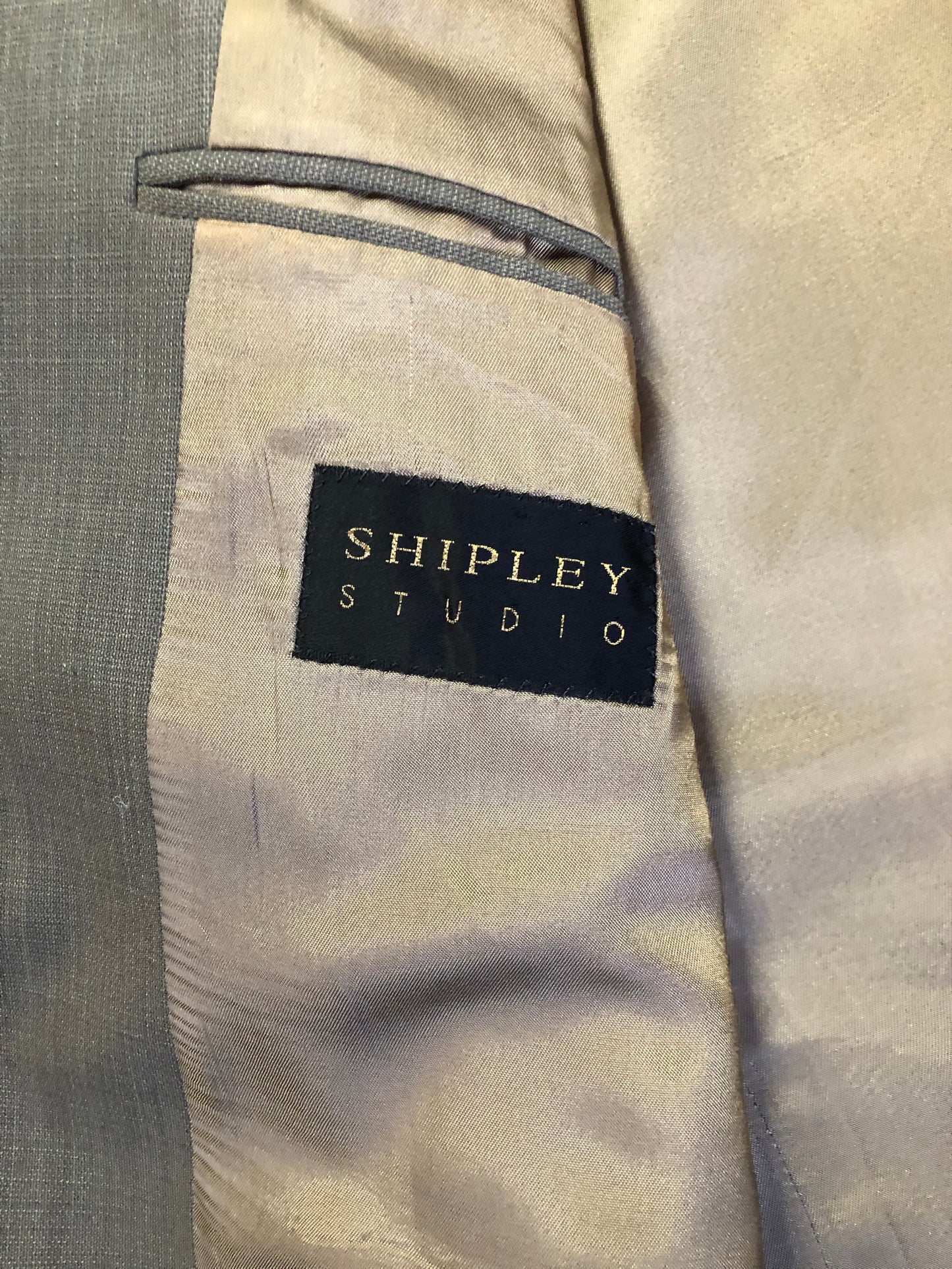 Kingspier Vintage - WM.H. Leishman (sold at Tip Top Tailors) two piece medium grey 100% pure virgin wool suit.The jacket is a single breasted, two button notch lapel with two flap pockets and two inside pockets. Pants are pleated with welt pockets. Made in Canada.