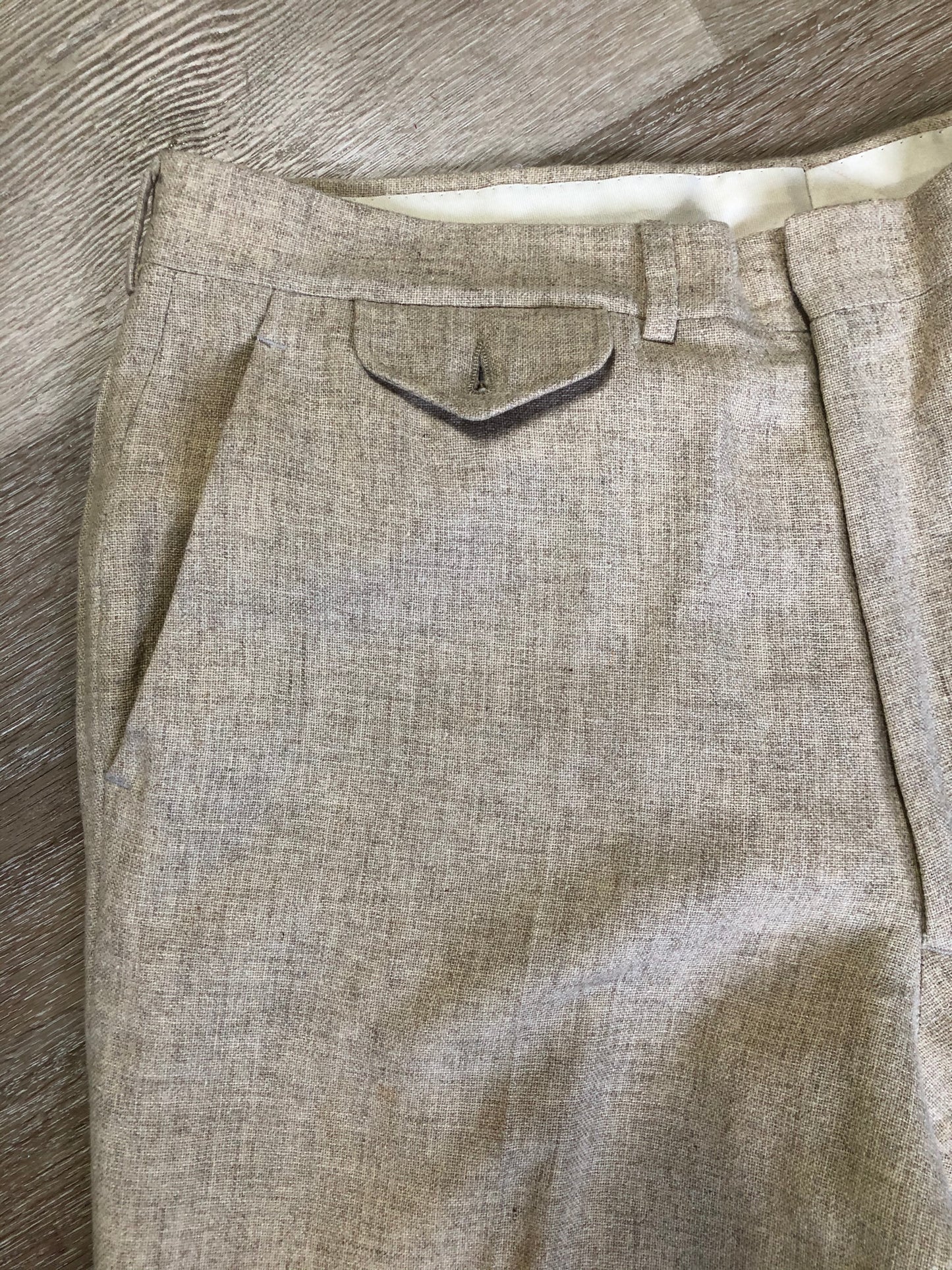 Kingspier Vintage - Chaps by Ralph Lauren light beige two piece suit at Martini Carl Boston. Jacket is a three button notch lapel with three flap pockets and a breast pocket. The pants are flat front with two slash pockets, a tiny flap pocket in the front and two back pockets.