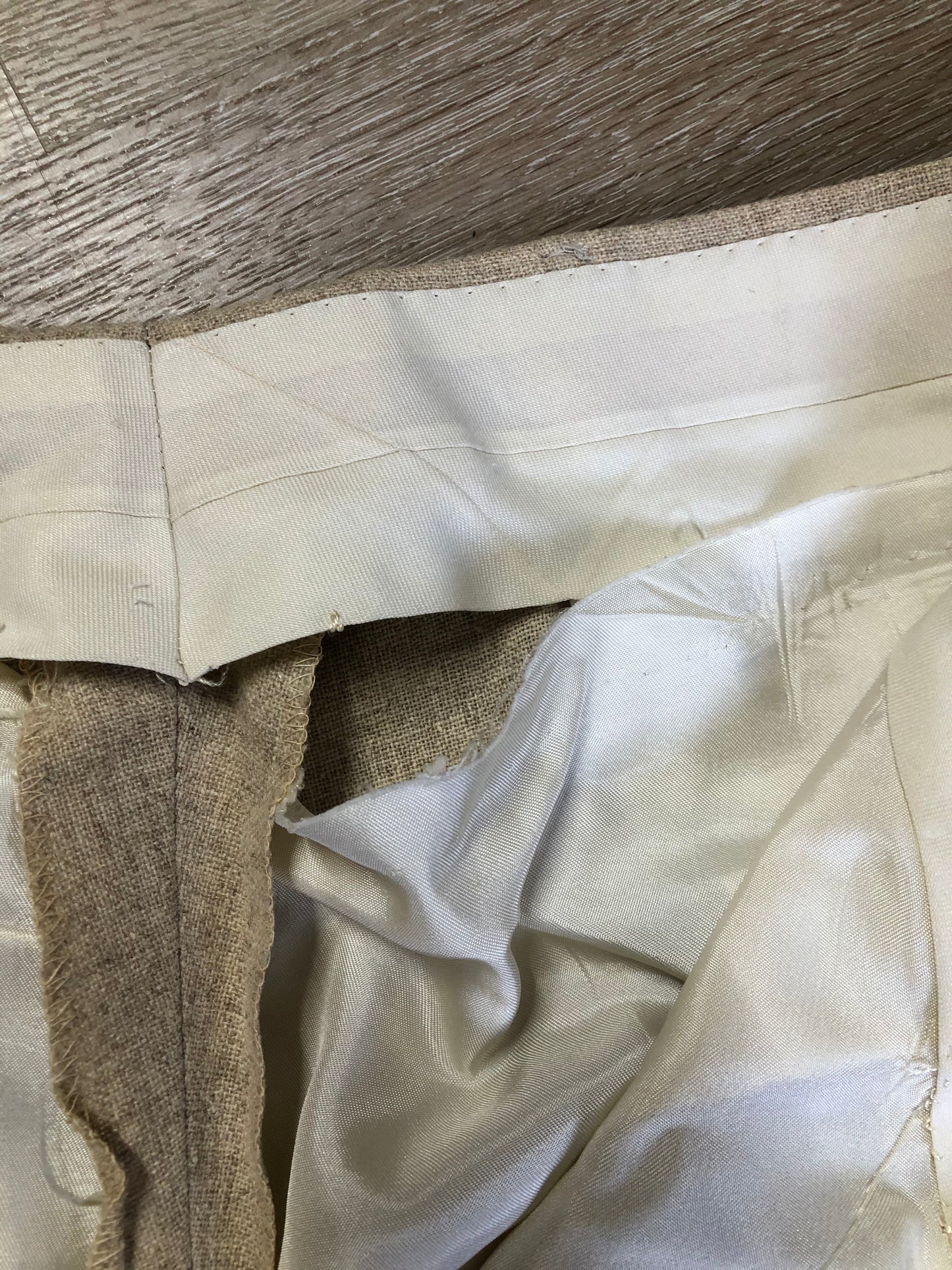 Kingspier Vintage - Chaps by Ralph Lauren light beige two piece suit at Martini Carl Boston. Jacket is a three button notch lapel with three flap pockets and a breast pocket. The pants are flat front with two slash pockets, a tiny flap pocket in the front and two back pockets.