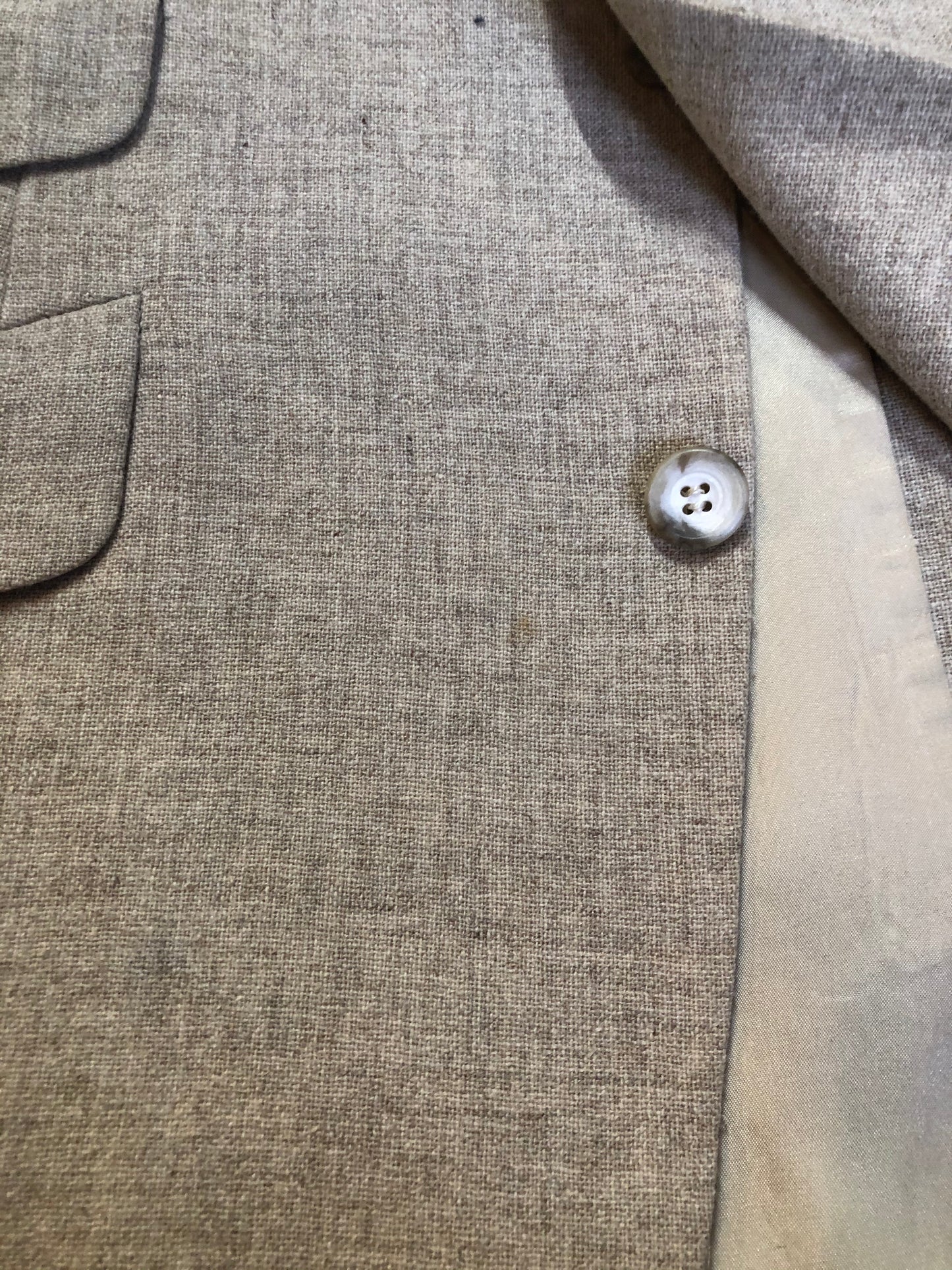 Kingspier Vintage - Chaps by Ralph Lauren light beige two piece suit at Martini Carl Boston. Jacket is a three button notch lapel with three flap pockets and a breast pocket. The pants are flat front with two slash pockets, a tiny flap pocket in the front and two back pockets.