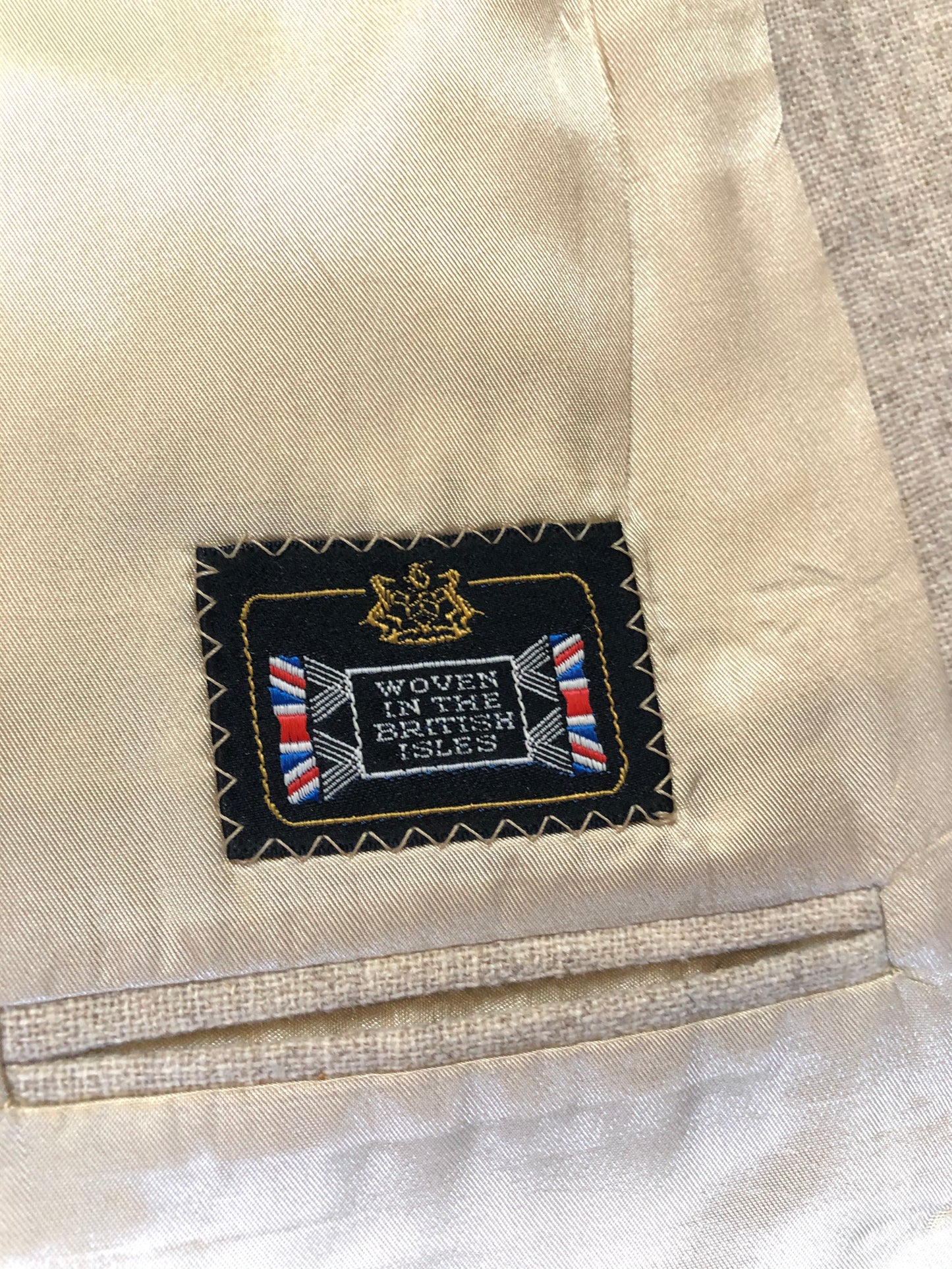 Kingspier Vintage - Chaps by Ralph Lauren light beige two piece suit at Martini Carl Boston. Jacket is a three button notch lapel with three flap pockets and a breast pocket. The pants are flat front with two slash pockets, a tiny flap pocket in the front and two back pockets.