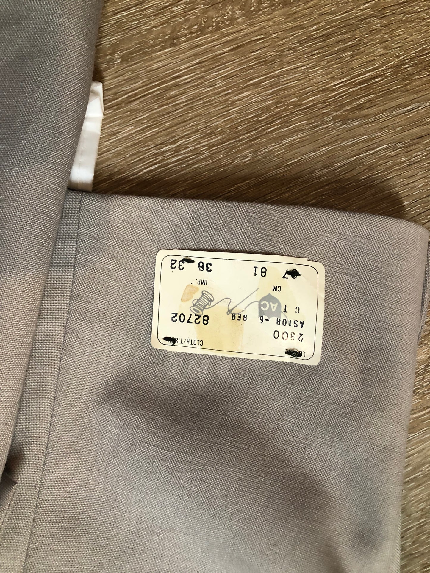 Kingspier Vintage - Georgio De Medici beige wool blend two piece suit, at R.W. Phinney Ltd - Cornwallis Clothes in Kentville, NS. The jacket is a two button notch lapel with two flap pockets, a breast pocket and three inside pockets. The pants are pleated with two front slash pockets and two welt pockets in the back.