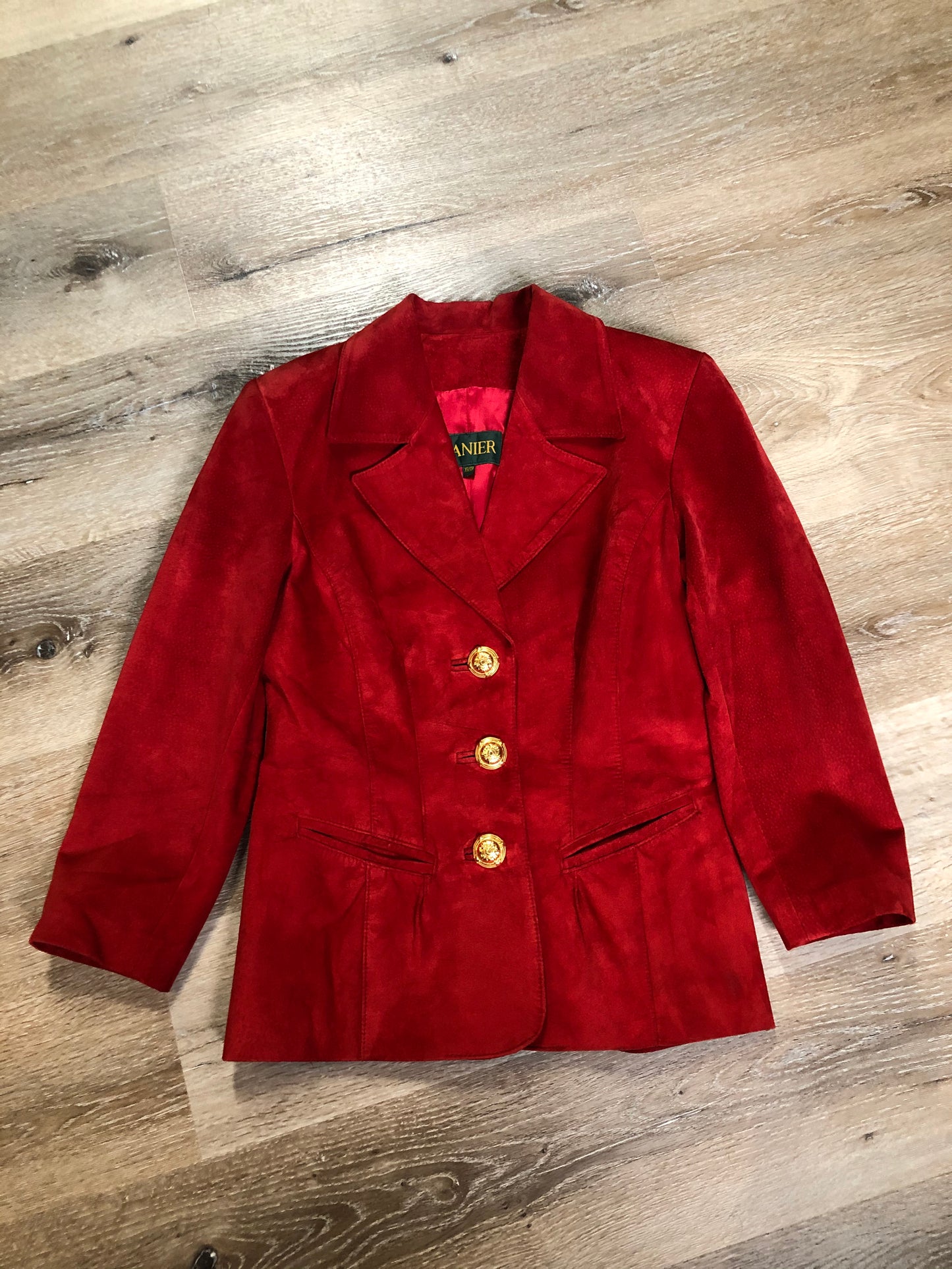 Kingspier Vintage - Danier red suede jacket with fitted silhouette, three gold decorative buttons and two slanted welt pockets. Size small.