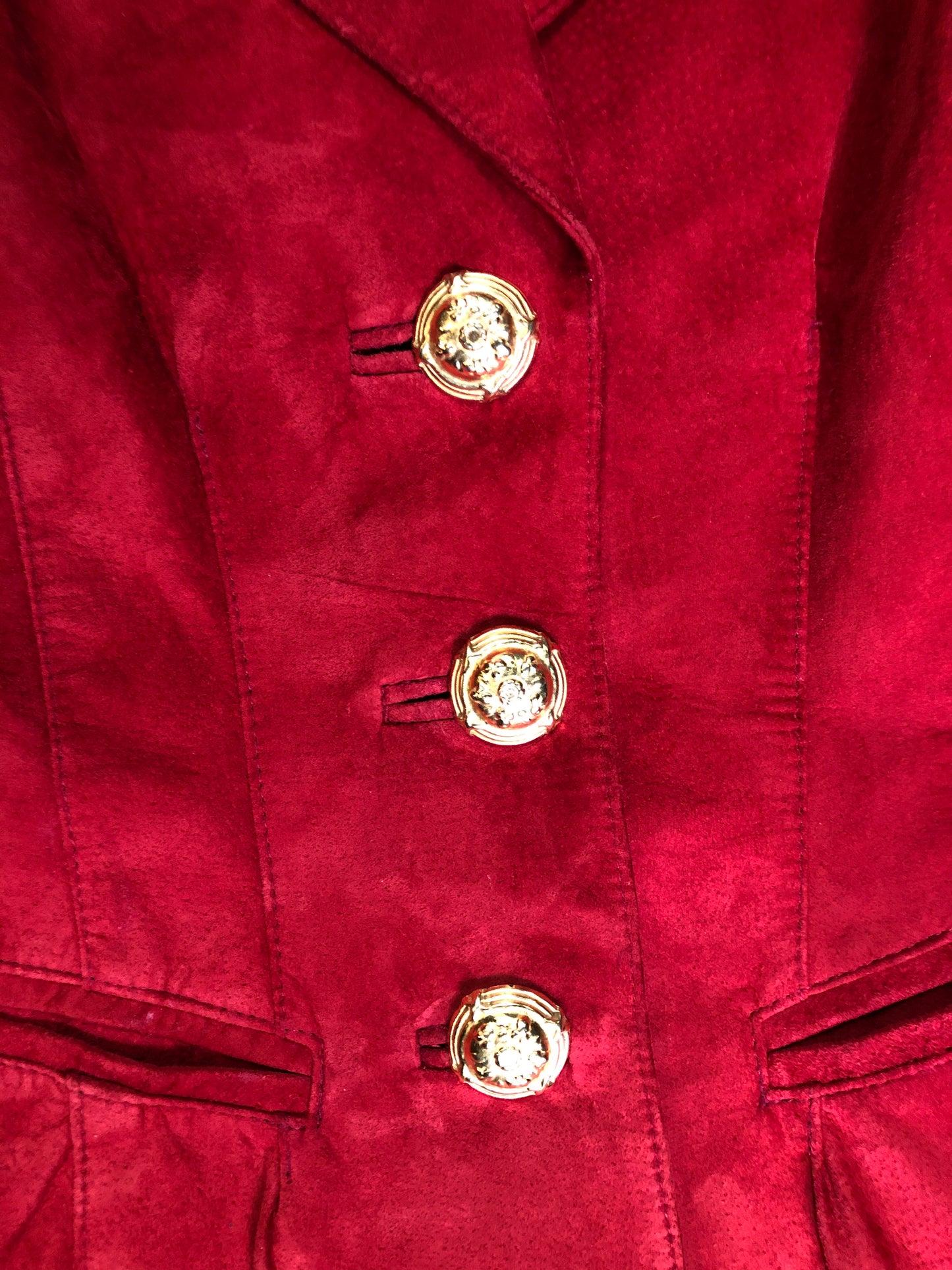 Kingspier Vintage - Danier red suede jacket with fitted silhouette, three gold decorative buttons and two slanted welt pockets. Size small.