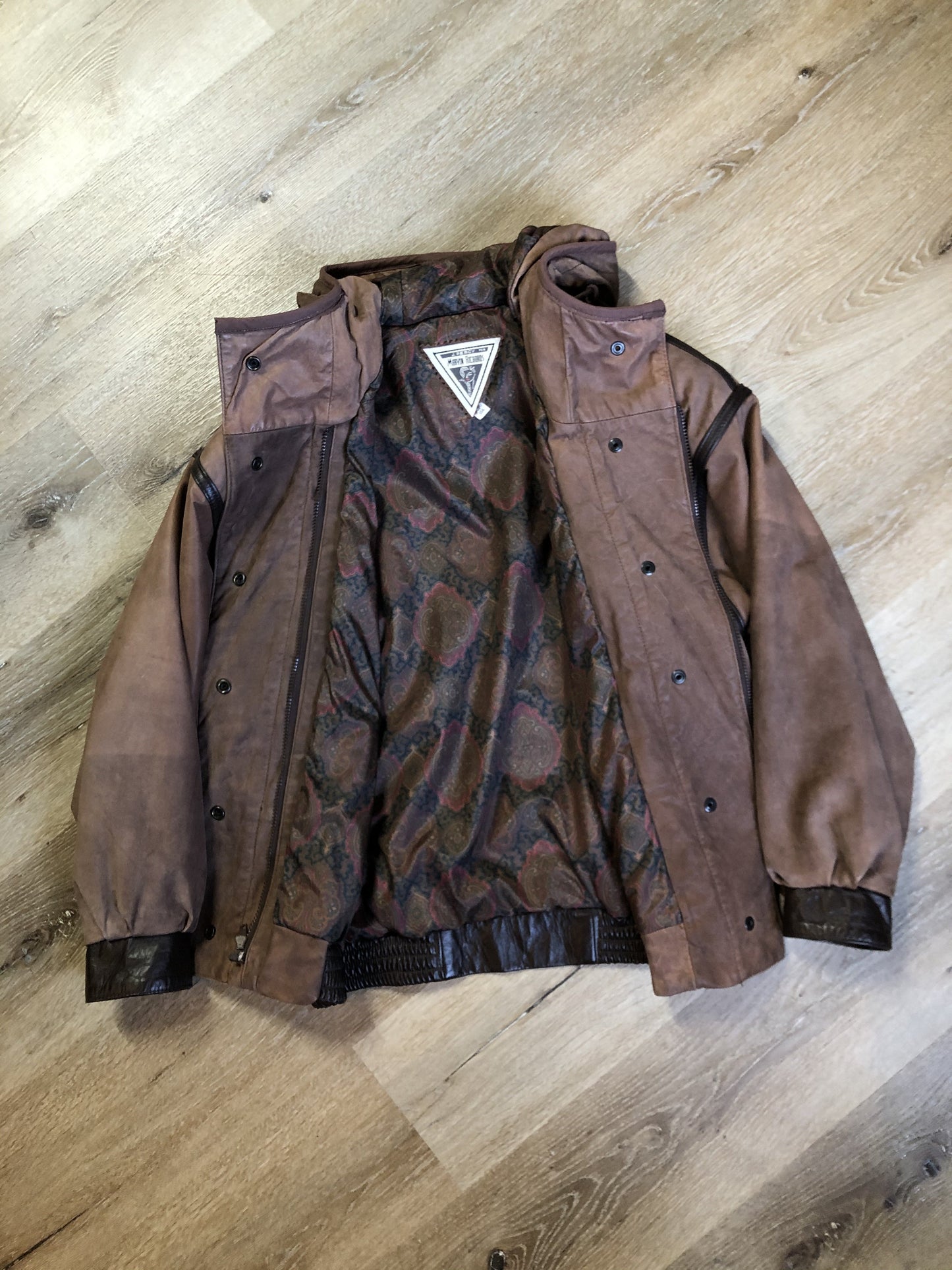Kingspier Vintage - J. Percy for Marvin Richards 1980’s/1990’s brown nubuck leather jacket with dark brown leather details, hood, zipper and snap closures and paisley lining. Made in the USA. Size small.