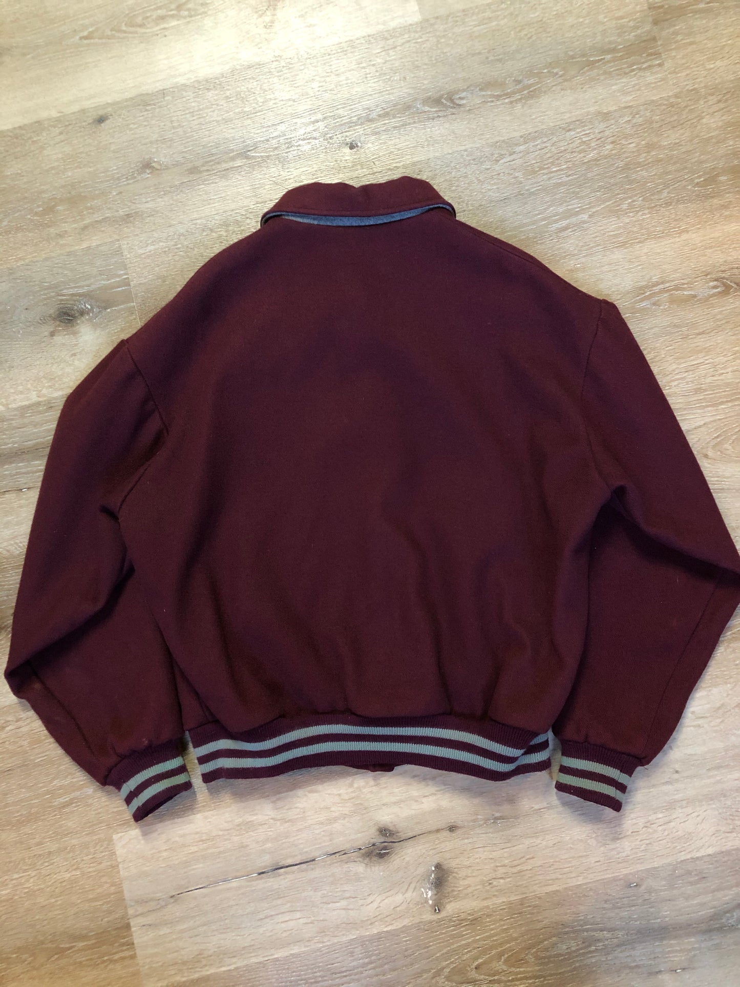 Kingspier Vintage - L.L.Bean bomber jacket in wine with snap closures with logo, knit trim and slash pockets. Size large.