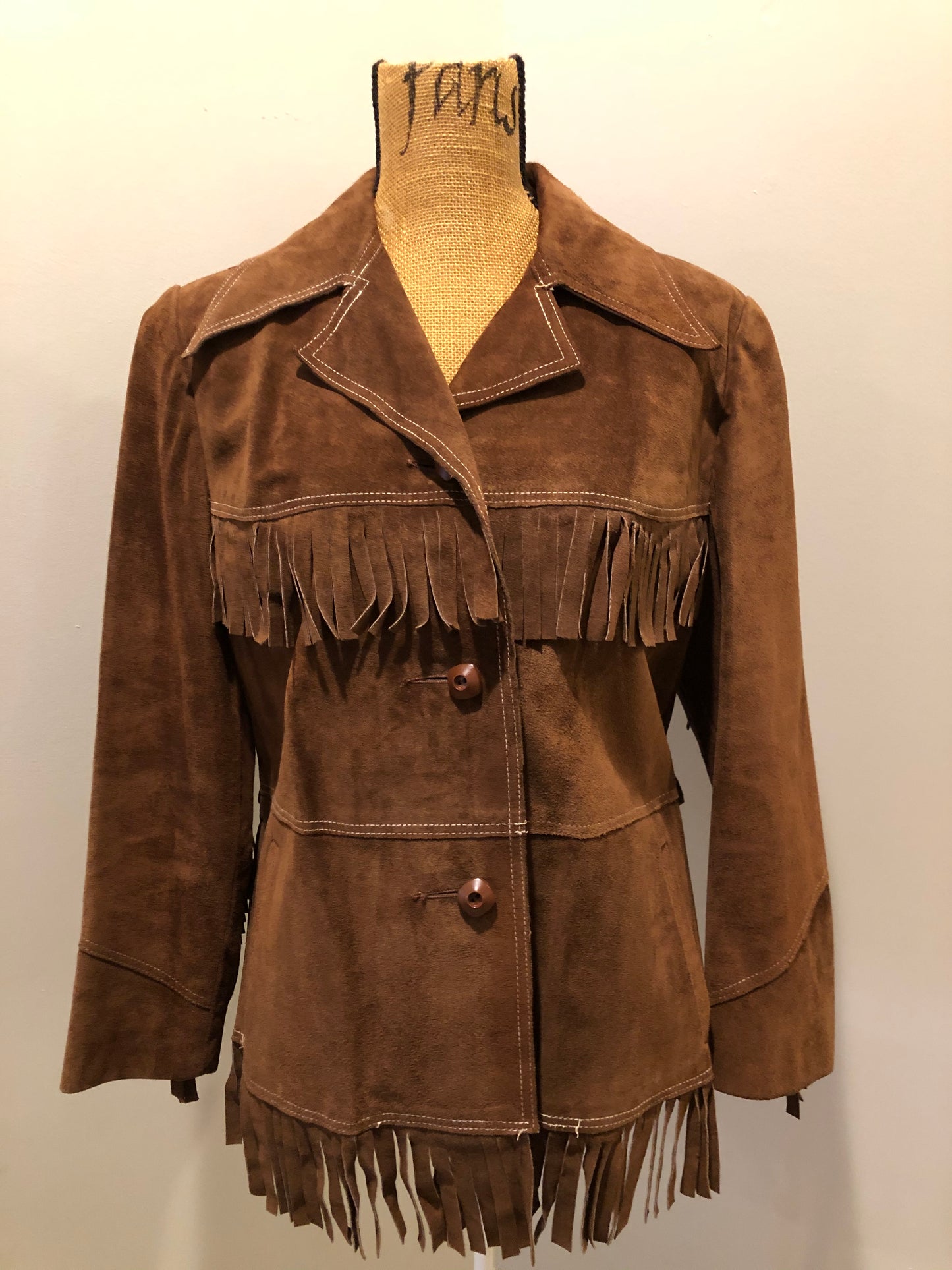 Kingspier Vintage - Jonathan Legault brown suede western style jacket with fringe details, belt in the back, button closures and slash pockets.