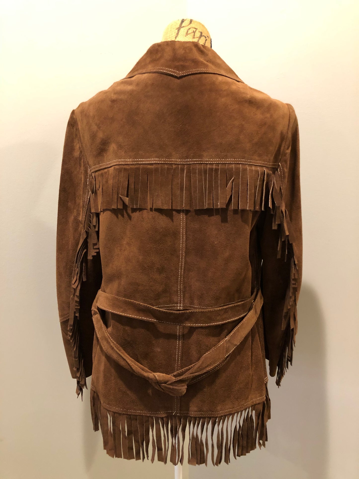 Kingspier Vintage - Jonathan Legault brown suede western style jacket with fringe details, belt in the back, button closures and slash pockets.