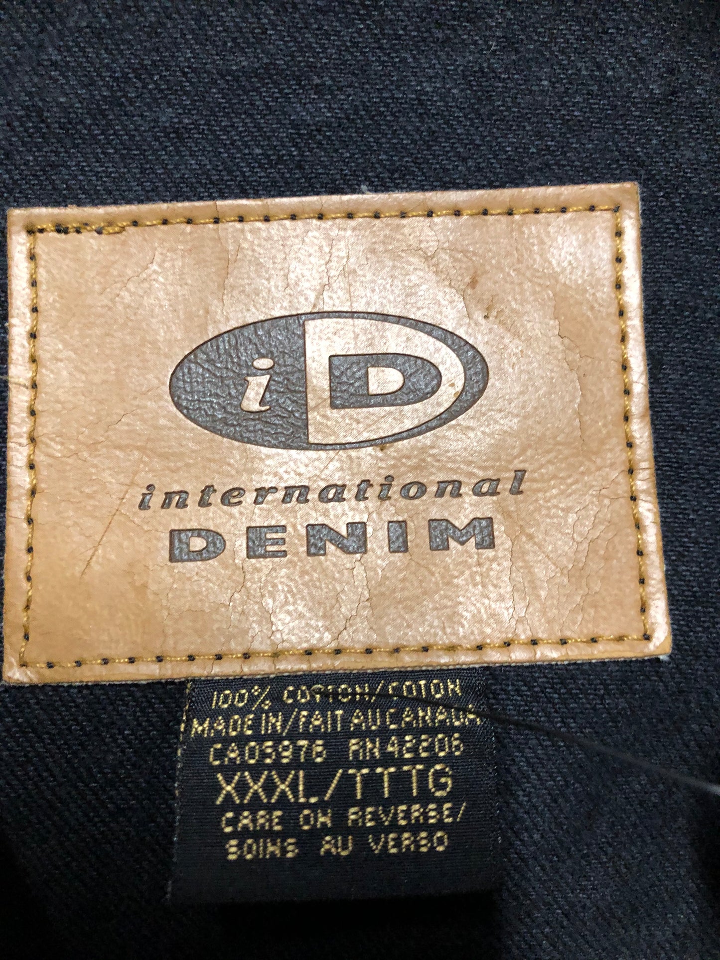 Kingspier Vintage - International Denim black denim jacket with button closures, two vertical pockets, two flap pockets and two inside pockets. Made in Canada. Size XXXL.