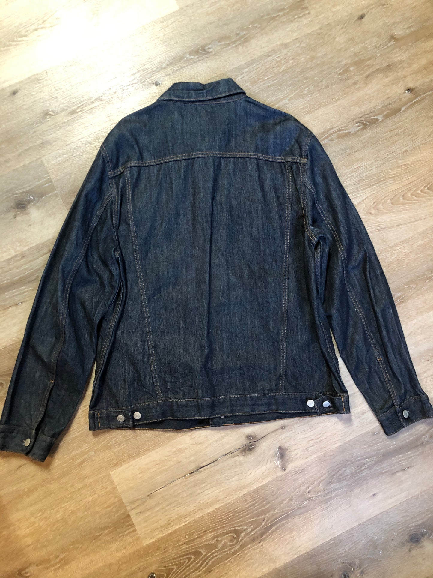 Kingspier Vintage - Gap denim jacket in a dark wash with gold stitching, button closures, two vertical pockets, two flap pockets and two inside pockets. Size XXL.