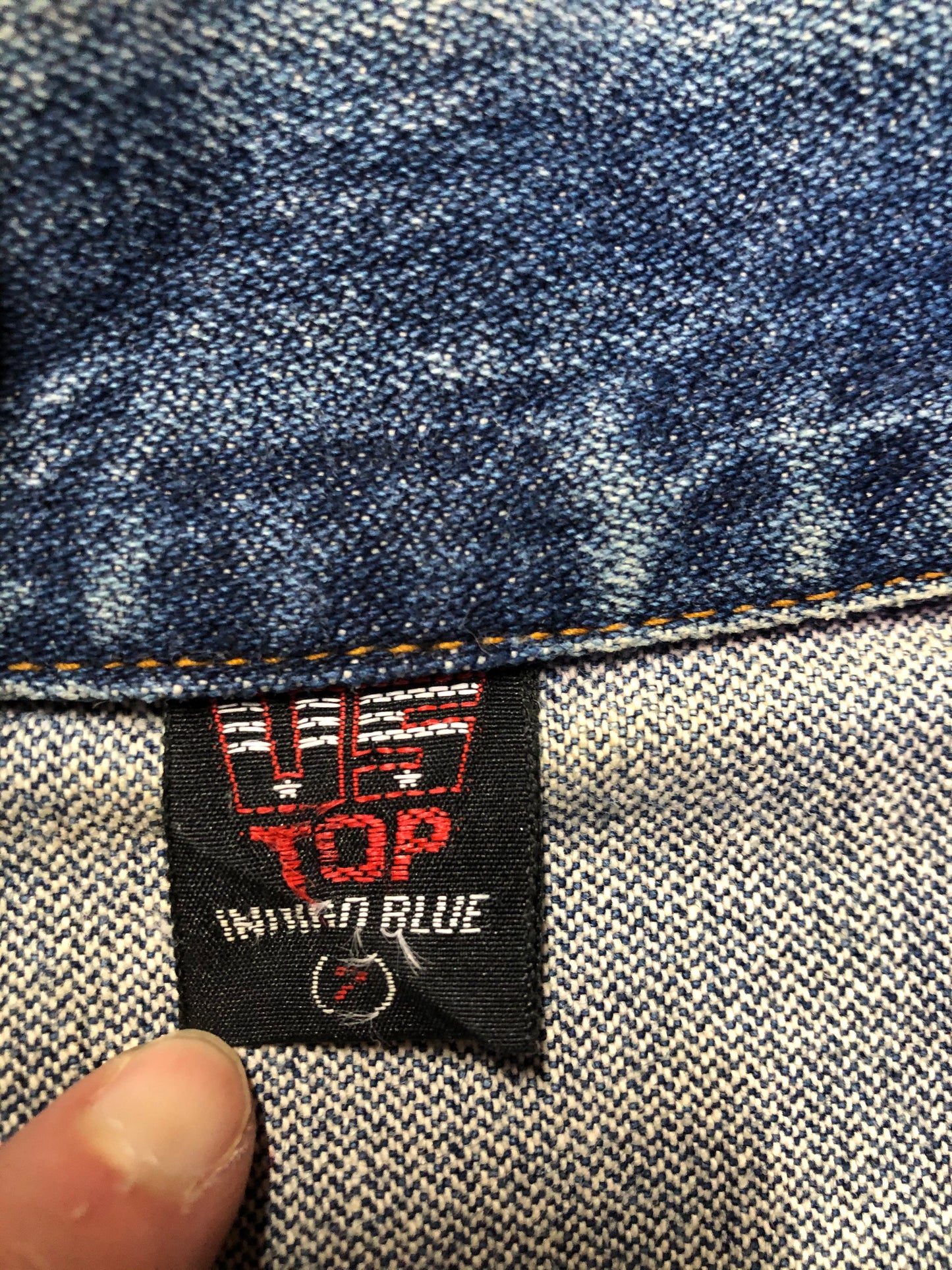 Kingspier Vintage - US Top denim jacket in a medium wash with button closures, two flap pockets on the chest, gold stitching with a unique stitch design down the center front.