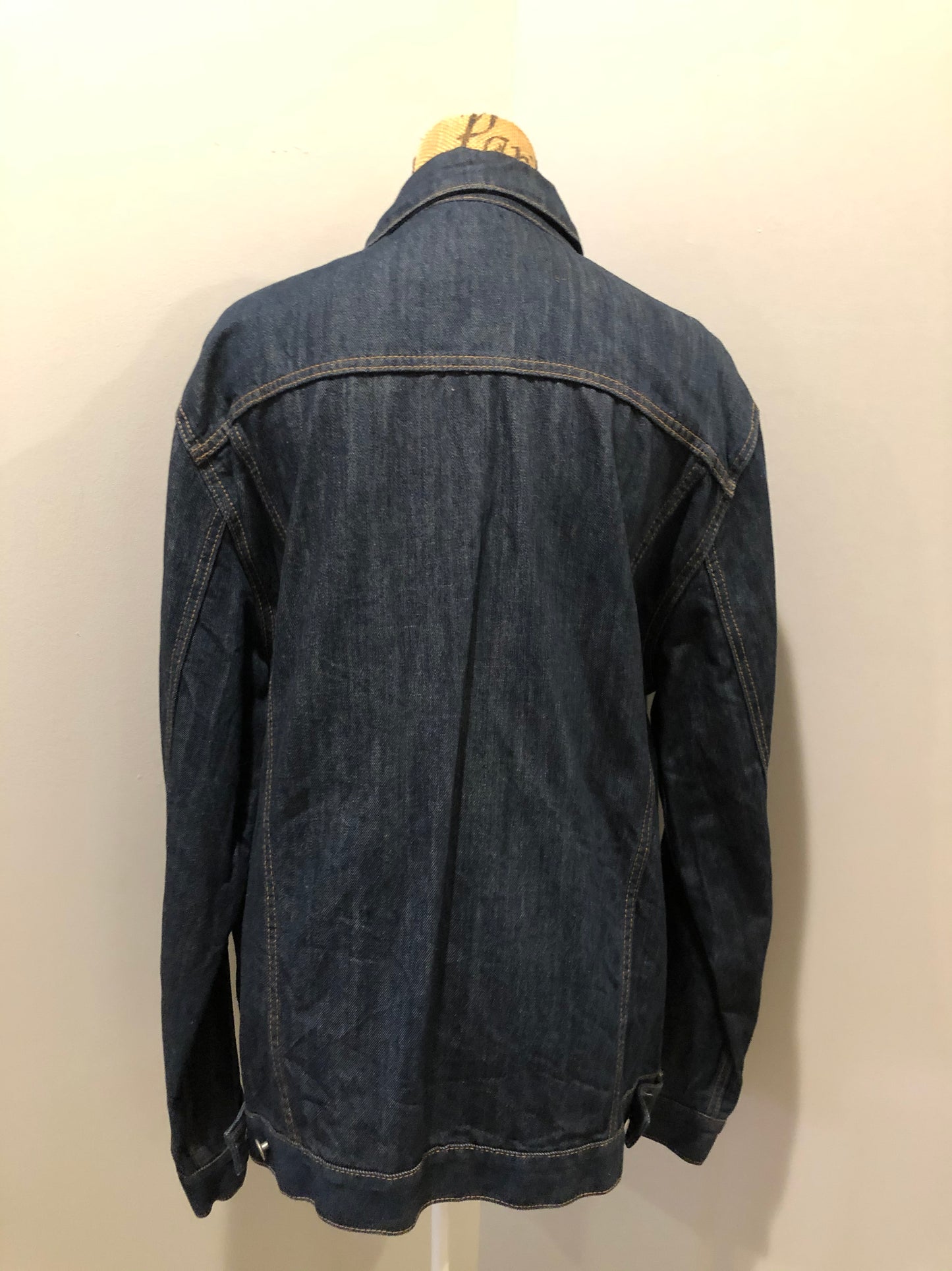 Kingspier Vintage - Gap denim jacket in a dark wash with gold stitching, button closures, two vertical pockets, two flap pockets and two inside pockets. Size XXL.