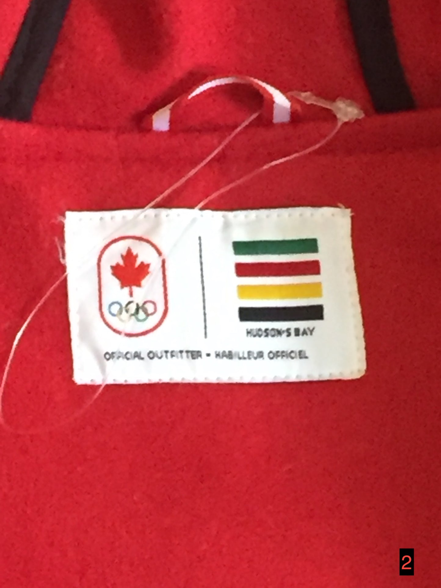 Kingspier Vintage - Hudson’s Bay Company official 2014 Olympics duffle coat in red with hood, toggles, zipper and flap pockets. Size is small.