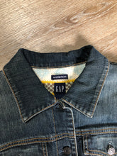 Load image into Gallery viewer, Kingspier Vintage - Gap denim jacket in a “dirty wash” with a colourful 100% lambswool lining, quilted lining in the arms, button closures and two flap pockets on the chest. Size large.
