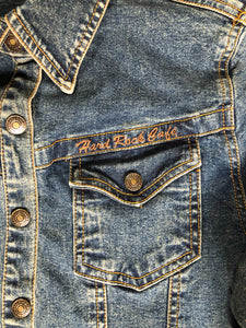 Kingspier Vintage - Hard Rock Cafe denim work shirt style jacket in a “dirty wash” with snap closures, flap pockets, “Hard Rock Cafe” is stitched above the pocket and "Chicago" is stitched on the cuff. Size small.