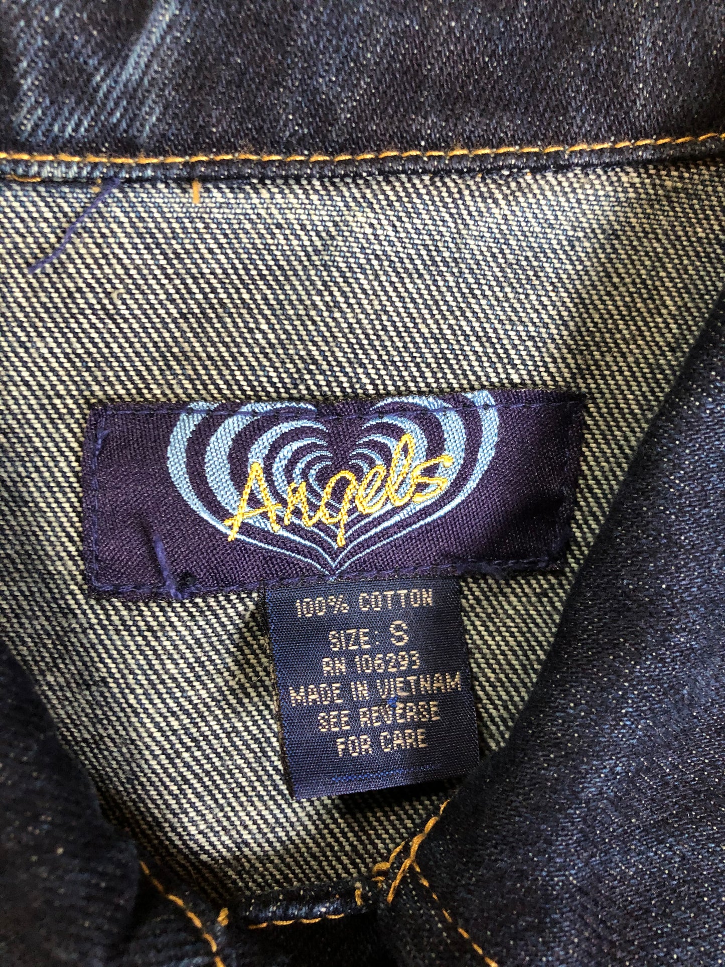 Kingspier Vintage - Angels denim jacket in a dark wash with button closures and two flap pockets. Size small.