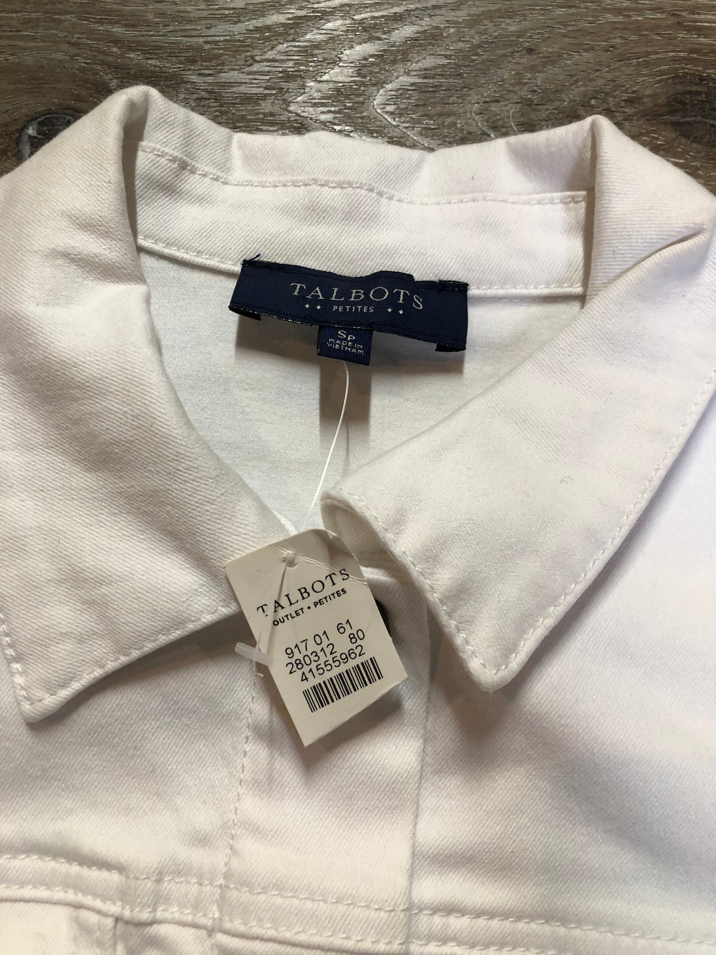 Kingspier Vintage - Talbots denim jacket in white with button closures, two vertical pockets and two flap pockets on the chest. Size small petite.