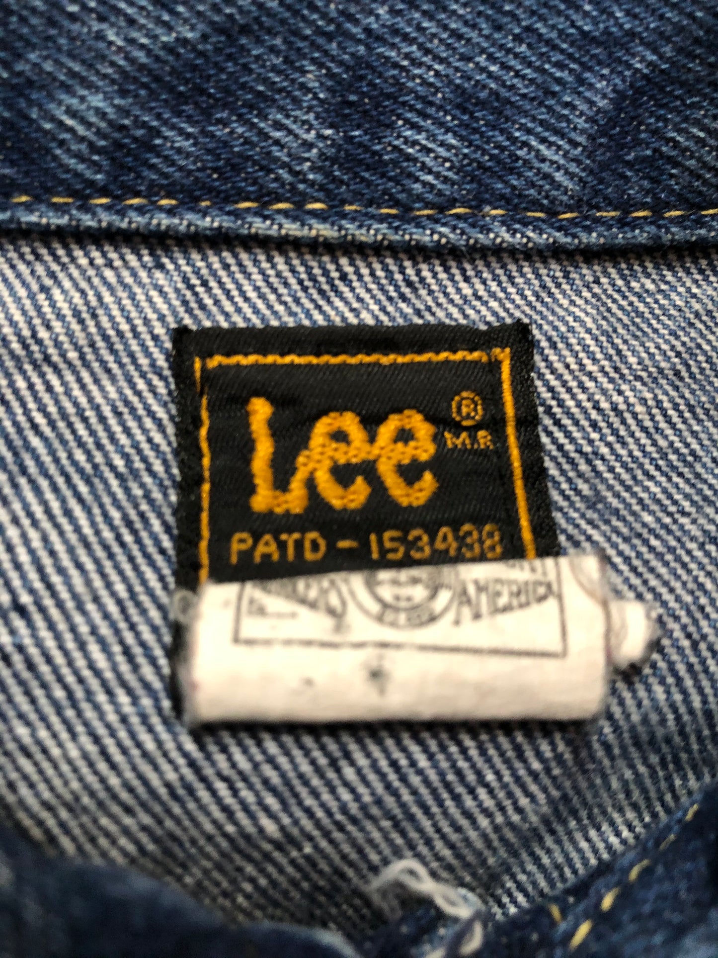 Kingspier Vintage - Lee denim jacket in a medium wash with unique stitching going down the Center front, button closures and two flap pockets on the chest. Union made in the USA. Size 8.