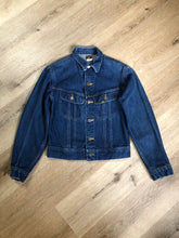 Load image into Gallery viewer, Kingspier Vintage - Lee denim jacket in a medium wash with unique stitching going down the Center front, button closures and two flap pockets on the chest. Union made in the USA. Size 8.
