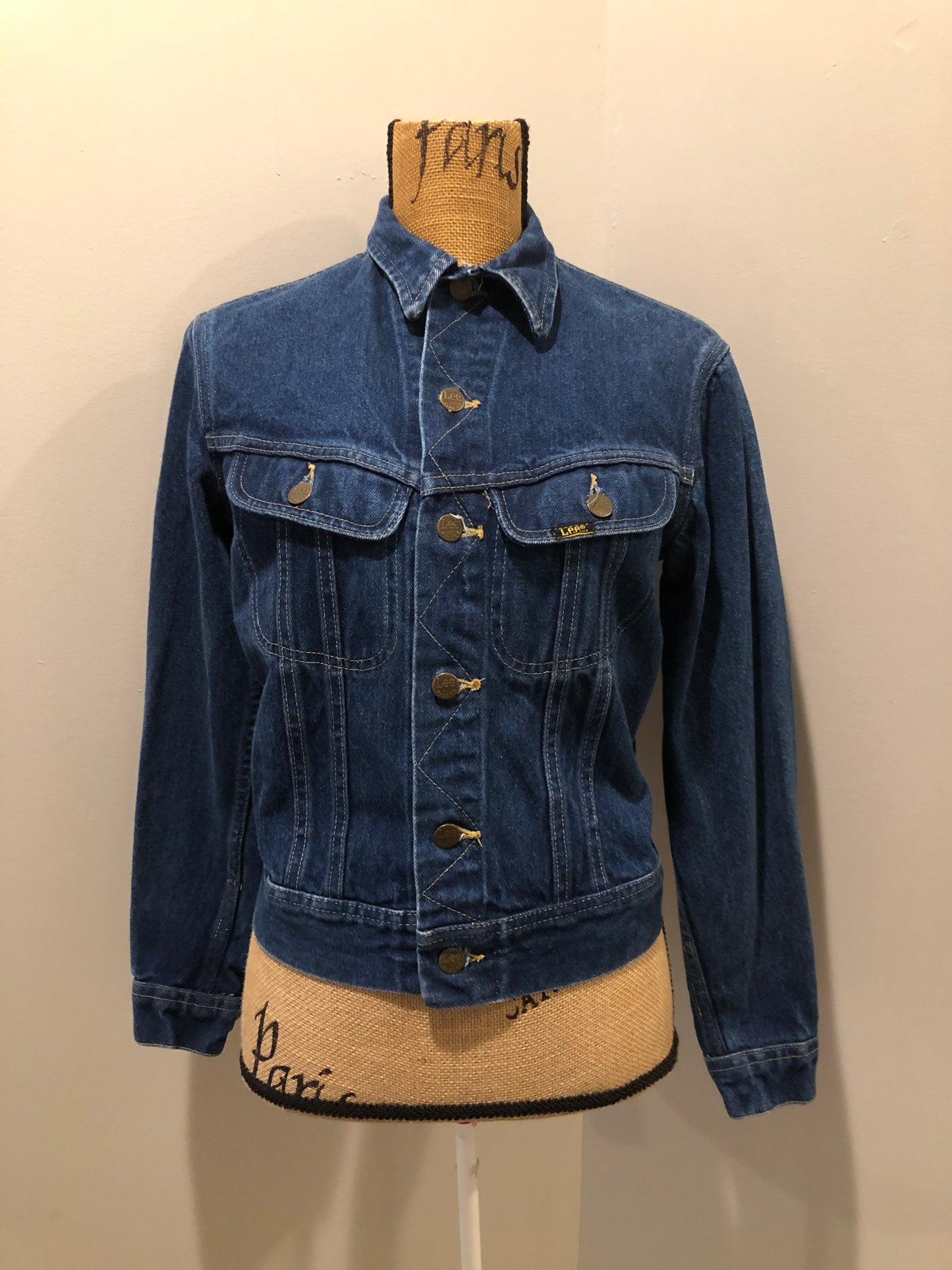 Kingspier Vintage - Lee denim jacket in a medium wash with unique stitching going down the Center front, button closures and two flap pockets on the chest. Union made in the USA. Size 8.