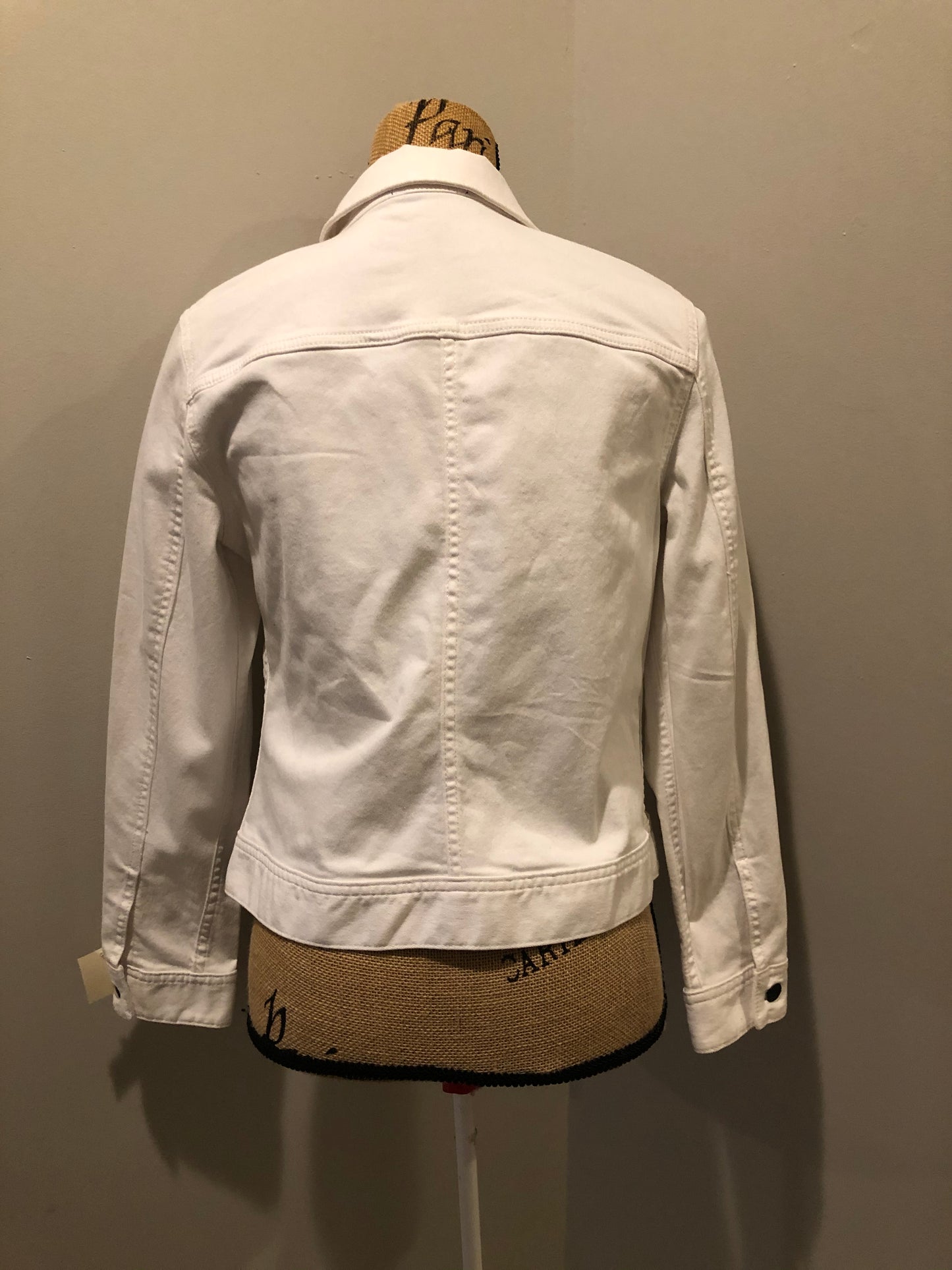 Kingspier Vintage - Talbots denim jacket in white with button closures, two vertical pockets and two flap pockets on the chest. Size small petite.