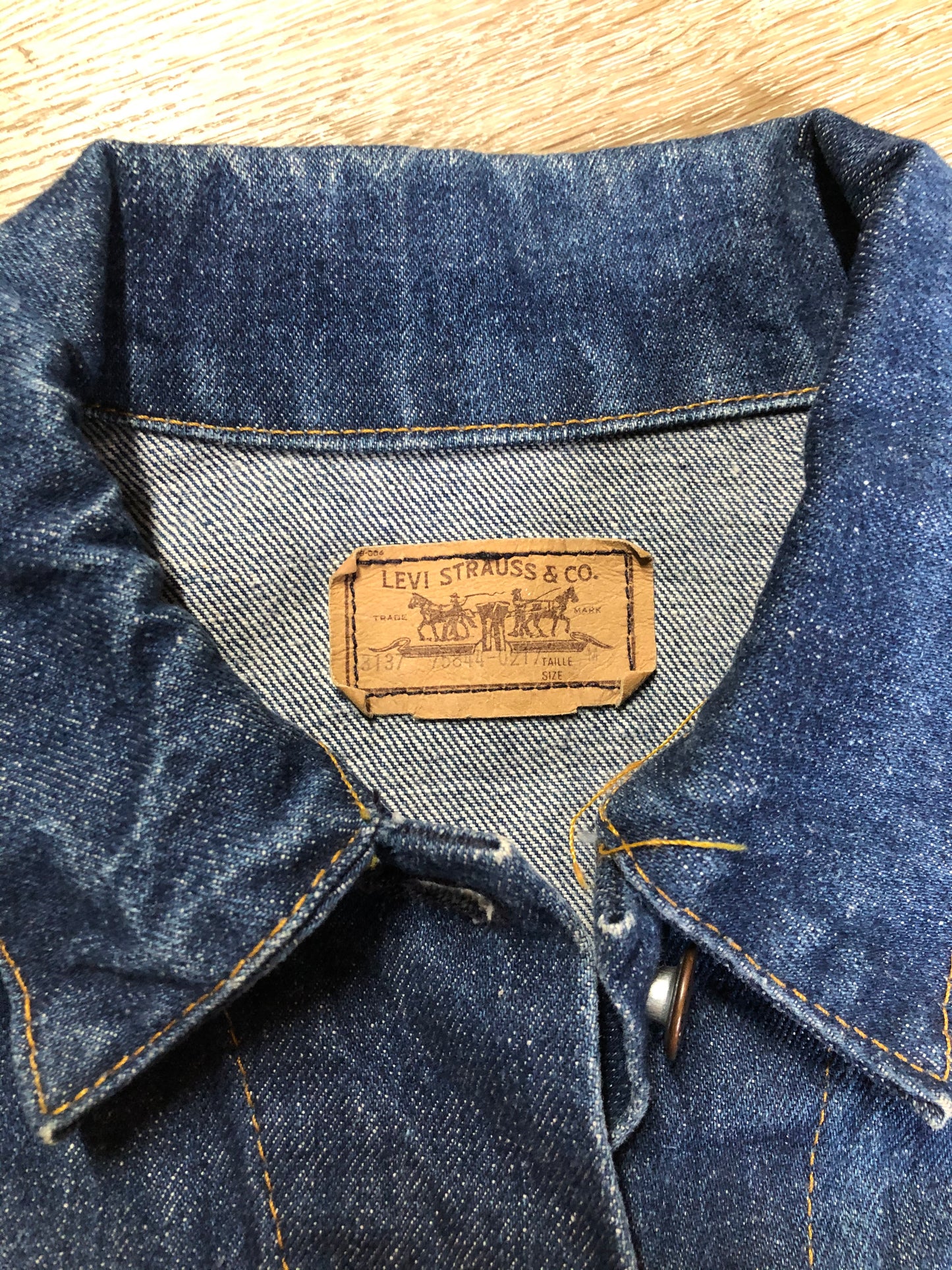 Kingspier Vintage - Levi’s denim jacket in a medium wash with button closures, hand warmer pockets, size medium.