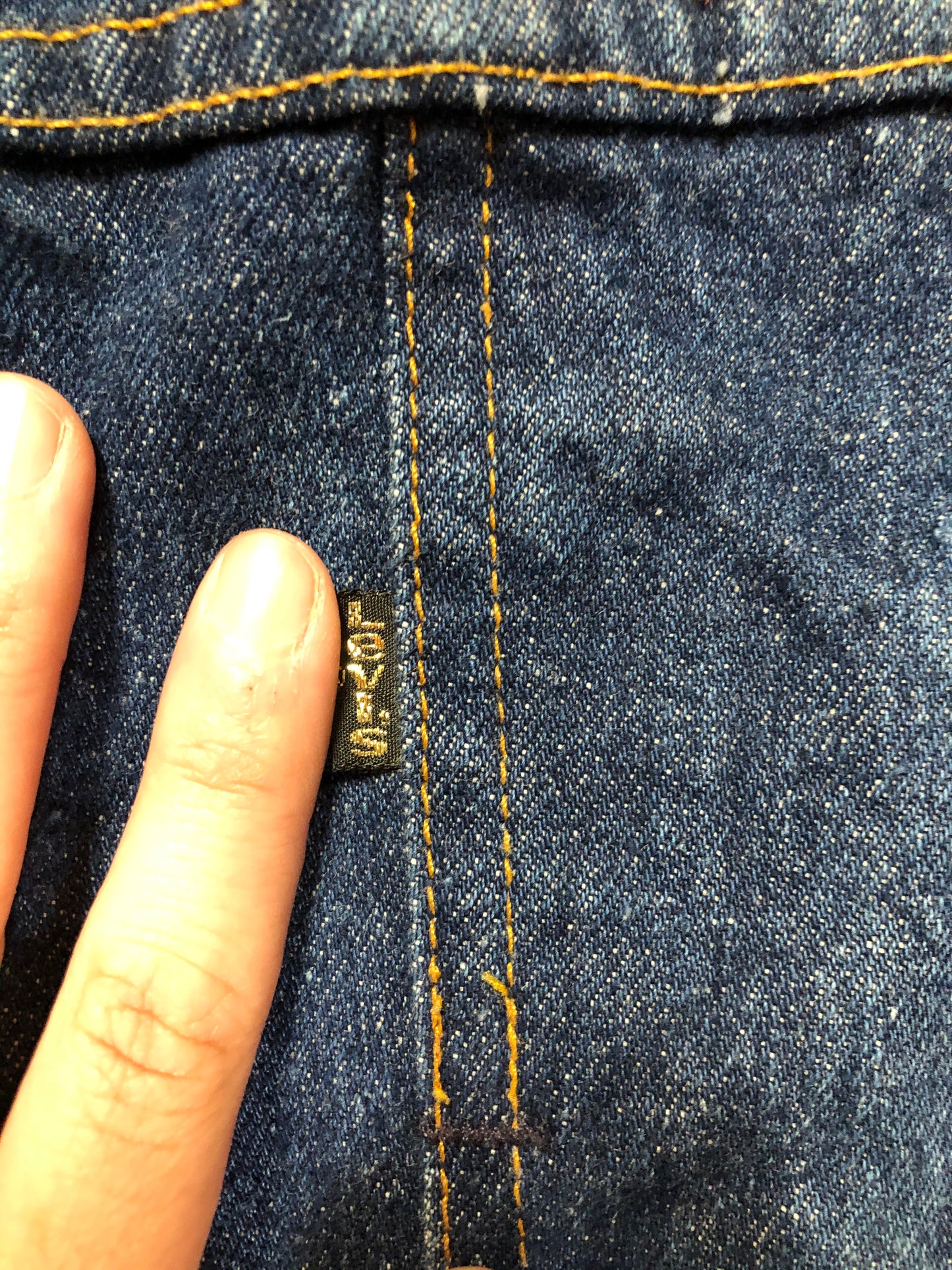 Kingspier Vintage - Levi’s denim jacket in a medium wash with button closures, hand warmer pockets, size medium.