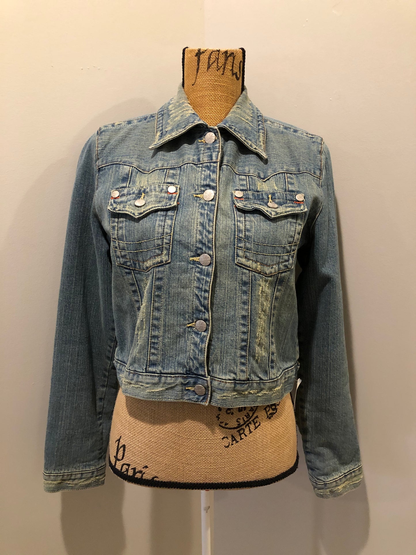 Kingspier Vintage - Younique denim jacket in a distressed light wash with colourful striped wool blend lining, button closures and two flap pockets. Size large, fits more like a medium.