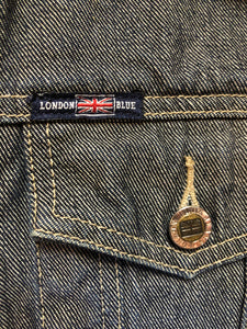 Kingspier Vintage - London Blue denim jacket in faded medium wash with button closures, vertical pockets, flap pockets on the chest and inside pockets. Size 3.
