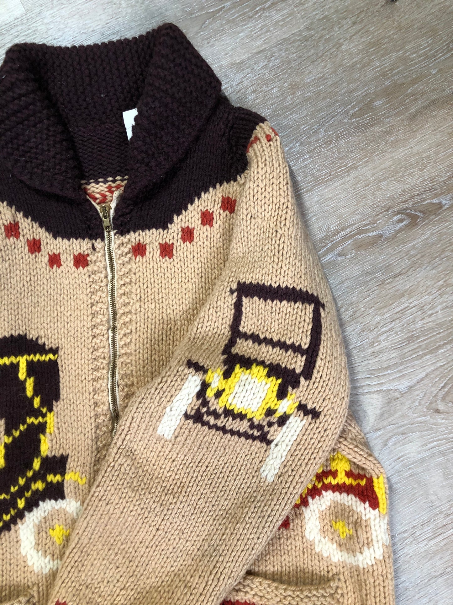 Kingspier Vintage - Mary Maxim hand knit wool zip cardigan in light brown with dark brown, red, yellow and cream with antique car design, raglan sleeves, zipper and pockets. Made in Nova Scotia.