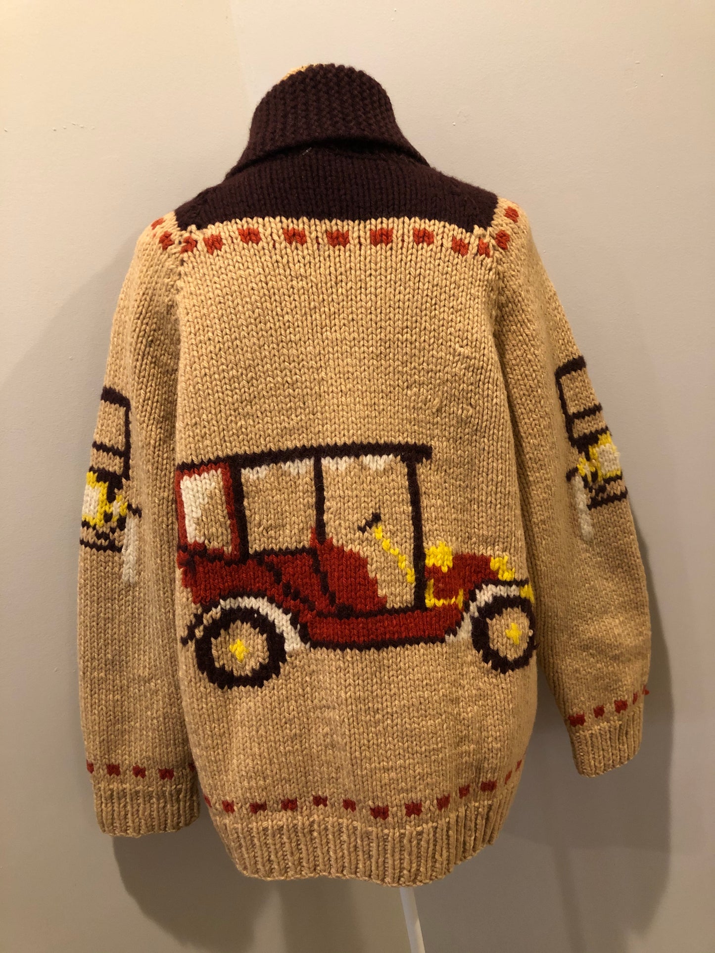 Kingspier Vintage - Mary Maxim hand knit wool zip cardigan in light brown with dark brown, red, yellow and cream with antique car design, raglan sleeves, zipper and pockets. Made in Nova Scotia.