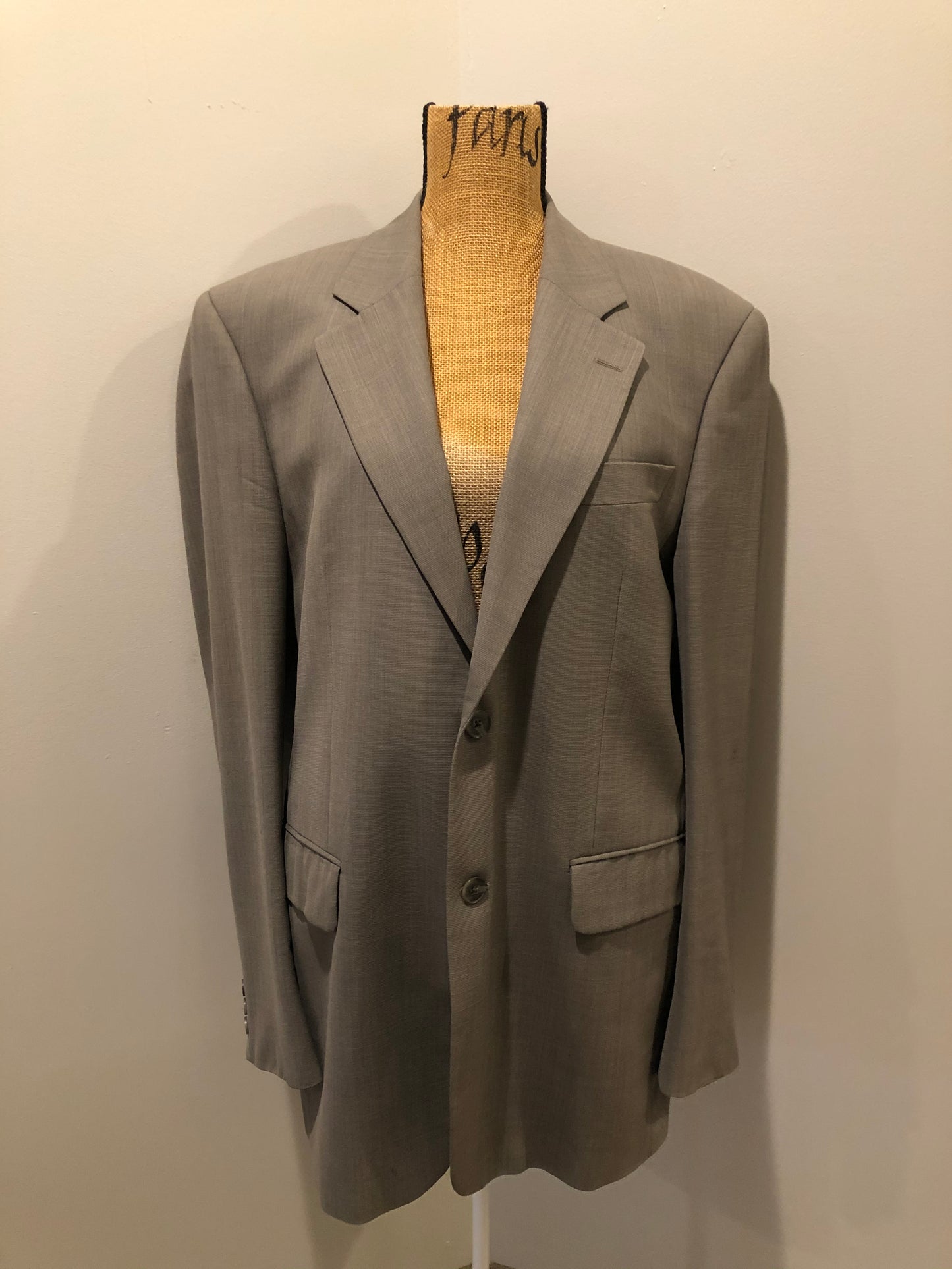Kingspier Vintage - WM.H. Leishman (sold at Tip Top Tailors) two piece medium grey 100% pure virgin wool suit.The jacket is a single breasted, two button notch lapel with two flap pockets and two inside pockets. Pants are pleated with welt pockets. Made in Canada.