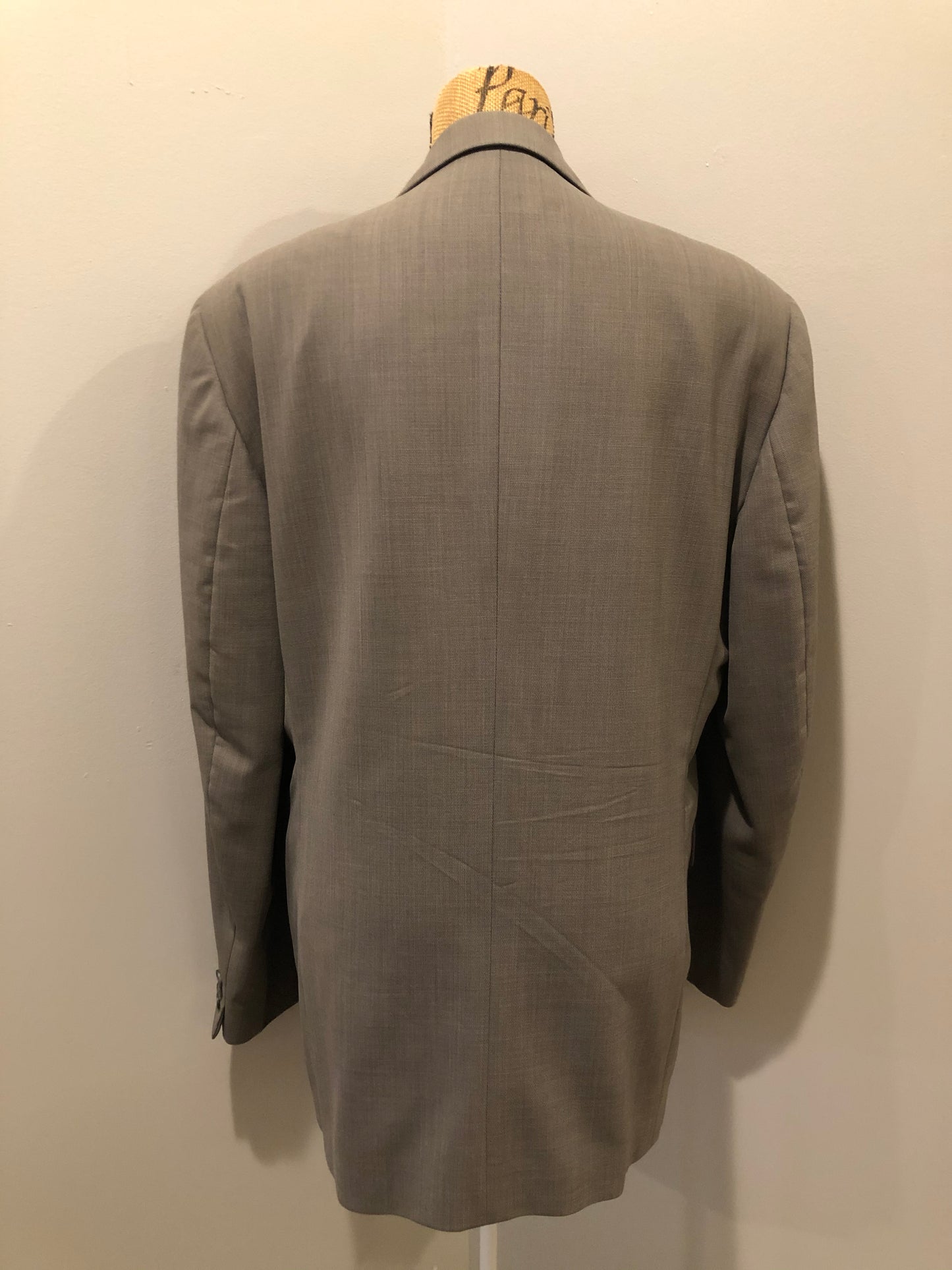 Kingspier Vintage - WM.H. Leishman (sold at Tip Top Tailors) two piece medium grey 100% pure virgin wool suit.The jacket is a single breasted, two button notch lapel with two flap pockets and two inside pockets. Pants are pleated with welt pockets. Made in Canada.