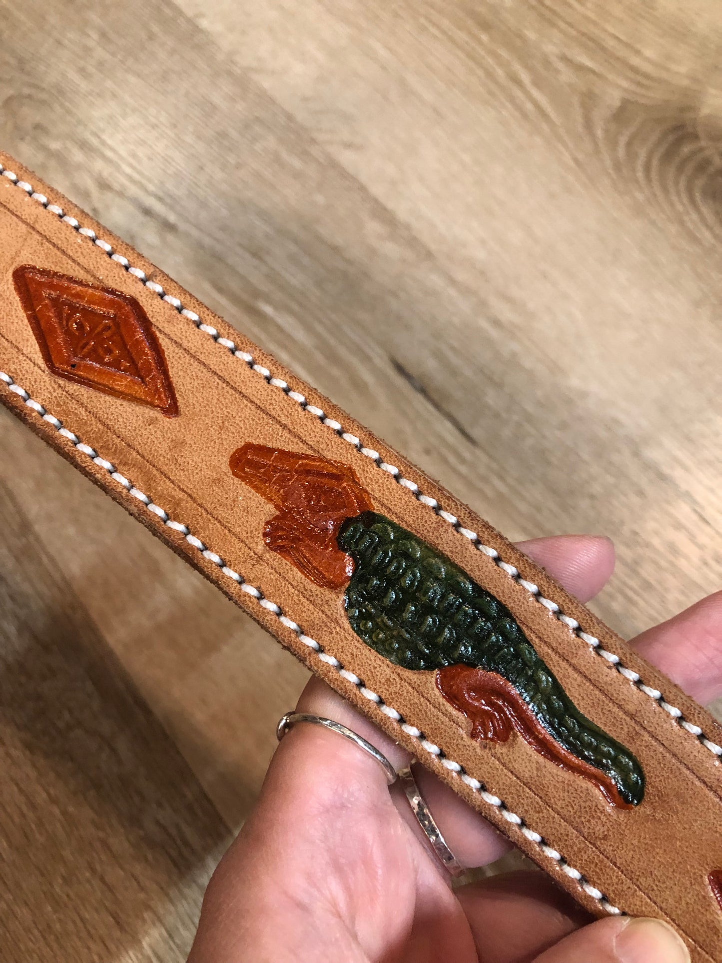 Kingspier Vintage -Vintage handtooled El Salvador brown full grain leather belt with crocodile motif and a leather wrapped buckle.
