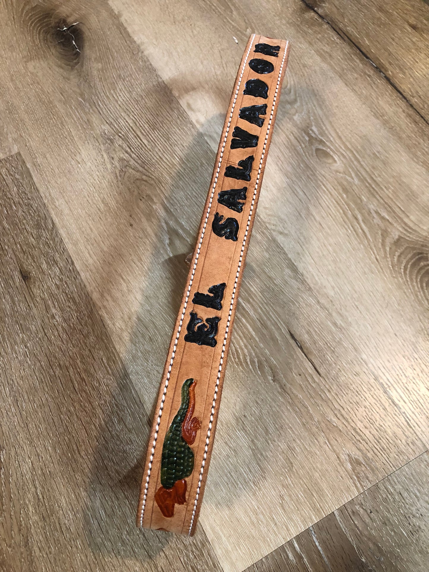 Kingspier Vintage -Vintage handtooled El Salvador brown full grain leather belt with crocodile motif and a leather wrapped buckle.