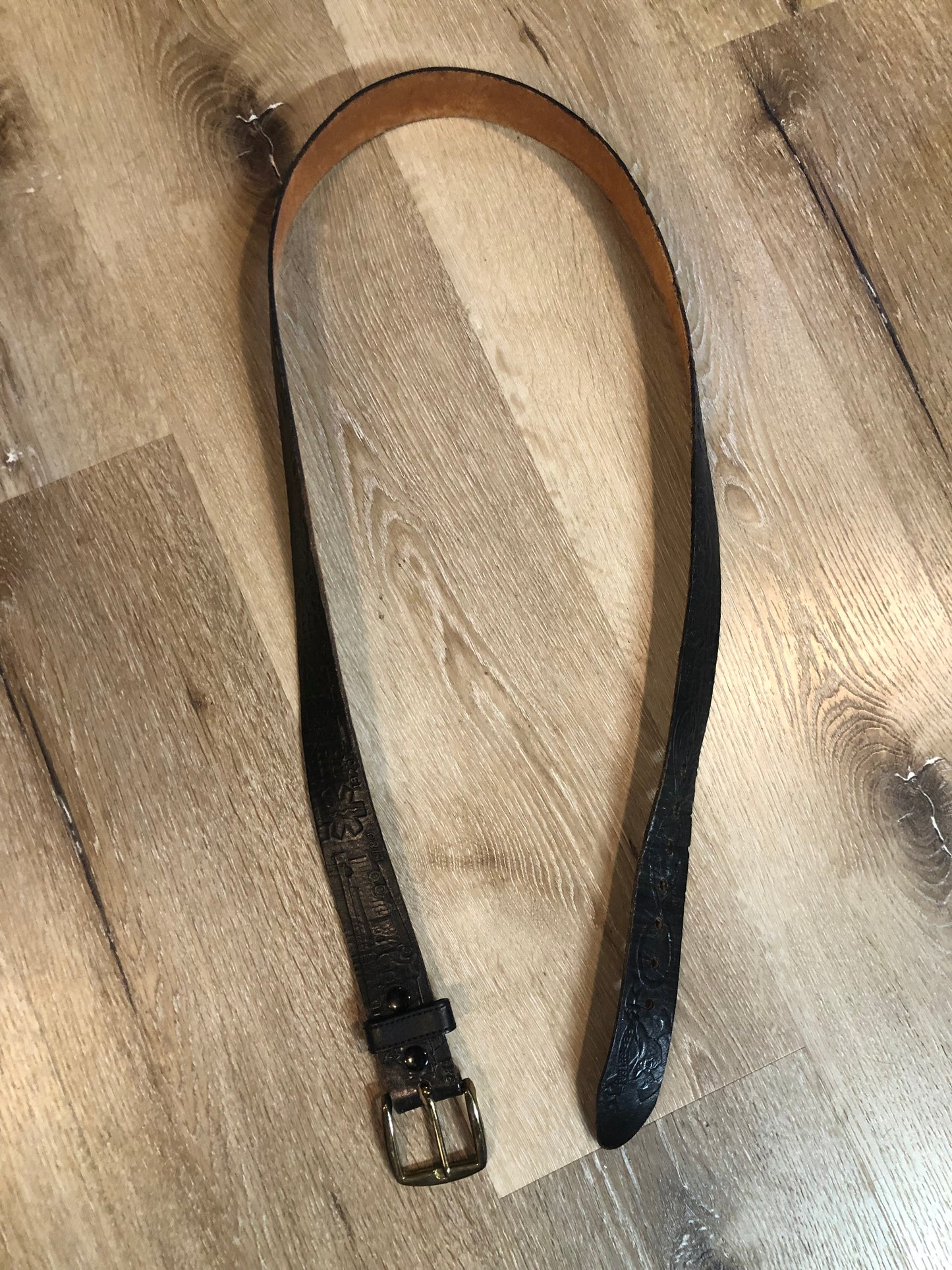 Kingspier Vintage - Vintage Noma Leather black full grain leather firefighter belt with brass buckle and embossed illustration of the evolution of the fire truck from 1922-1984. Made in Canada