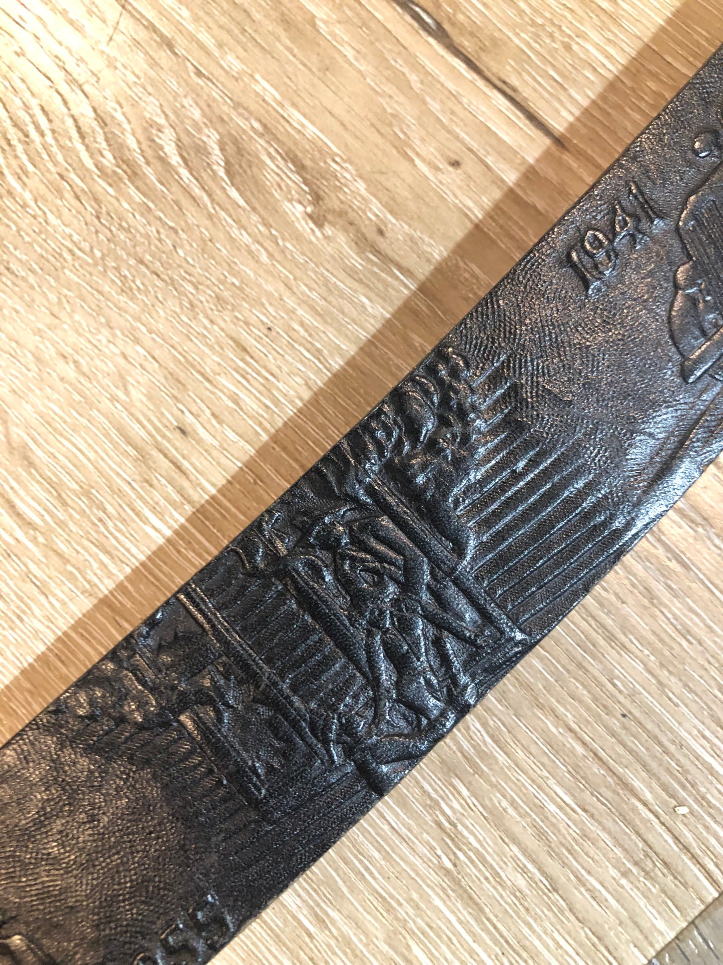 Kingspier Vintage - Vintage Noma Leather black full grain leather firefighter belt with brass buckle and embossed illustration of the evolution of the fire truck from 1922-1984. Made in Canada