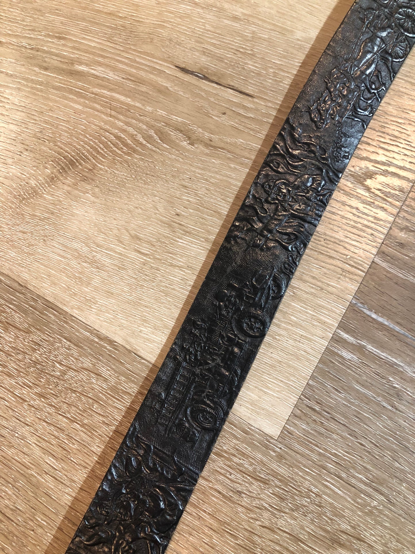 Kingspier Vintage - Vintage Noma Leather black full grain leather firefighter belt with brass buckle and embossed illustration of the evolution of the fire truck from 1922-1984. Made in Canada