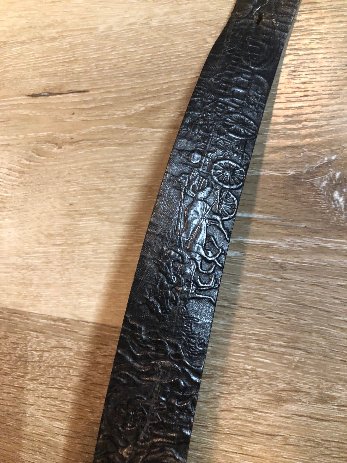 Kingspier Vintage - Vintage Noma Leather black full grain leather firefighter belt with brass buckle and embossed illustration of the evolution of the fire truck from 1922-1984. Made in Canada