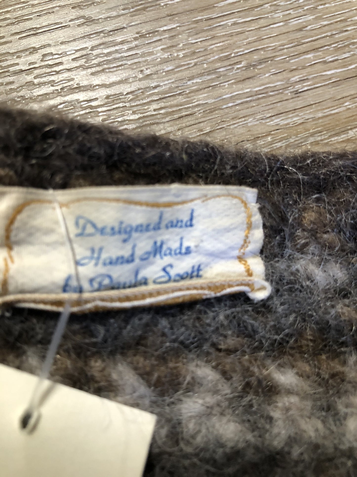 Kingspier Vintage - Paula Scott hand knit wool cardigan in a gradient pattern of beige to dark brown. This cardigan features wooden buttons and was handmade in Nova Scotia. Size medium/ large.