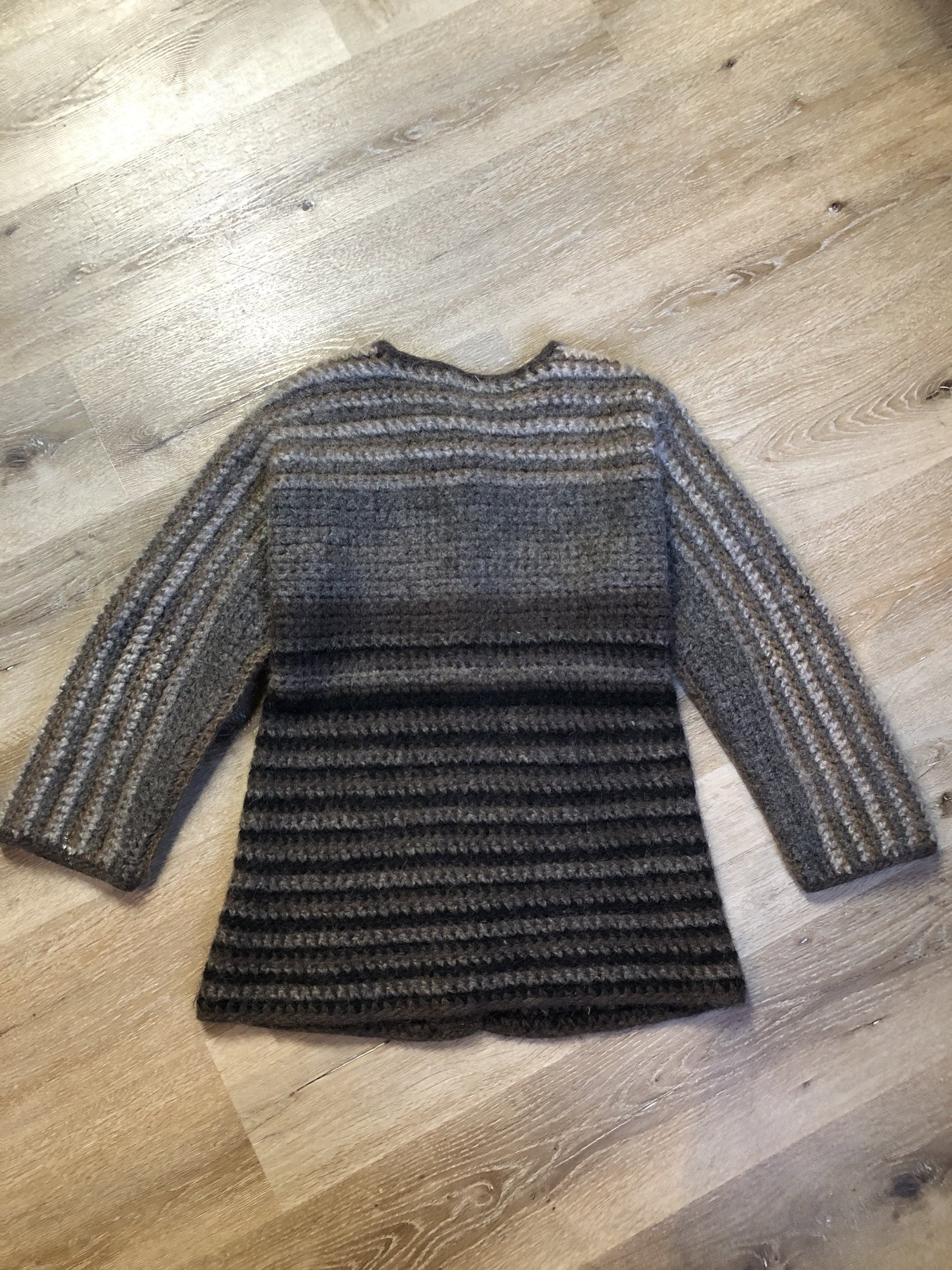 Kingspier Vintage - Paula Scott hand knit wool cardigan in a gradient pattern of beige to dark brown. This cardigan features wooden buttons and was handmade in Nova Scotia. Size medium/ large.