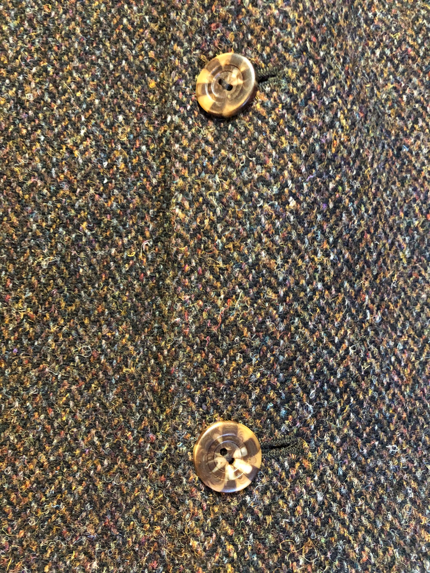 Kingspier Vintage - Harris Tweed brown and blue herringbone 100% wool jacket. This jacket is a three button, notch lapel with two flap pockets, a breast pocket and three inside pockets. Made in the Czech Republic.