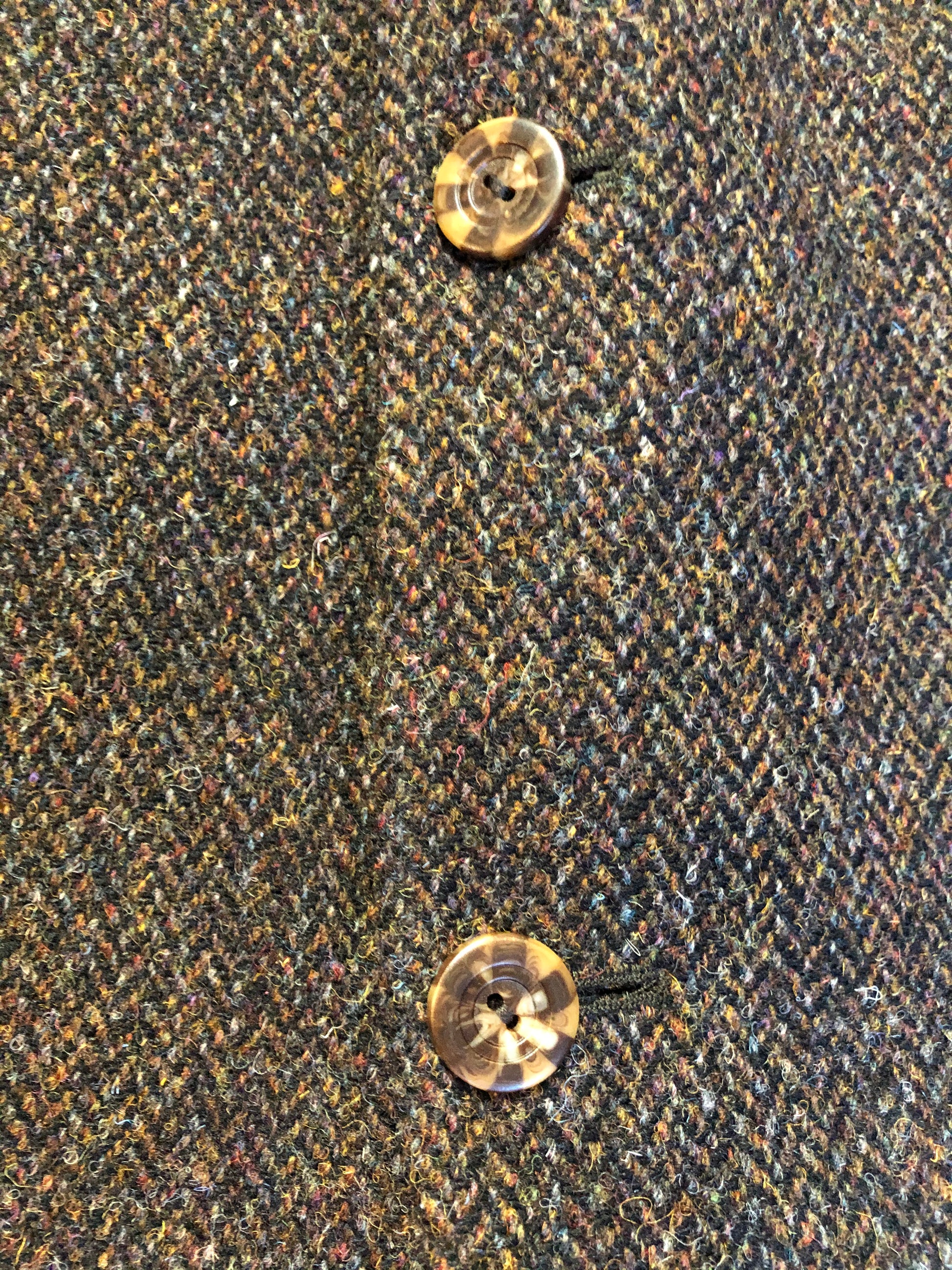 Kingspier Vintage - Harris Tweed brown and blue herringbone 100% wool jacket. This jacket is a three button, notch lapel with two flap pockets, a breast pocket and three inside pockets. Made in the Czech Republic.