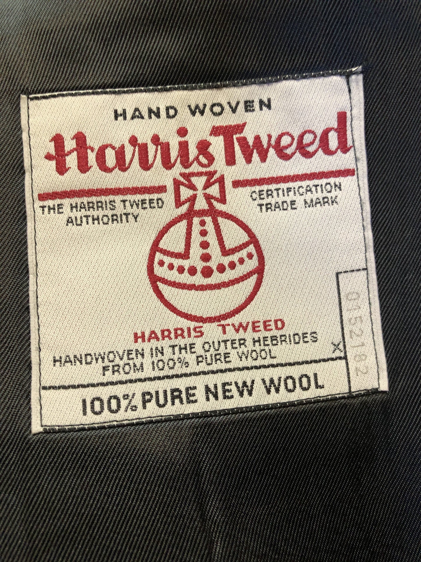 Kingspier Vintage - Harris Tweed brown and blue herringbone 100% wool jacket. This jacket is a three button, notch lapel with two flap pockets, a breast pocket and three inside pockets. Made in the Czech Republic.